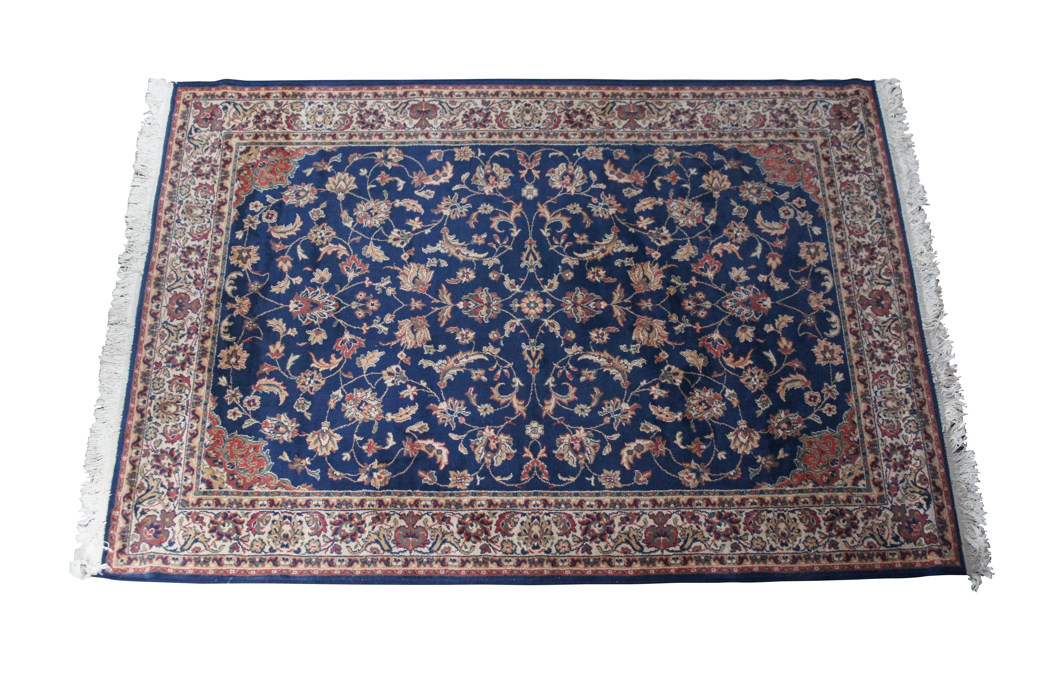 A beautiful blue floral all over Royal Persian area rug. Features an interlaced patter of crème, beige, reds and greens. Polypropylene BCF pile

Sarouk rugs are a type of Persian rug that are known for their vibrant colors, patterns, and floral