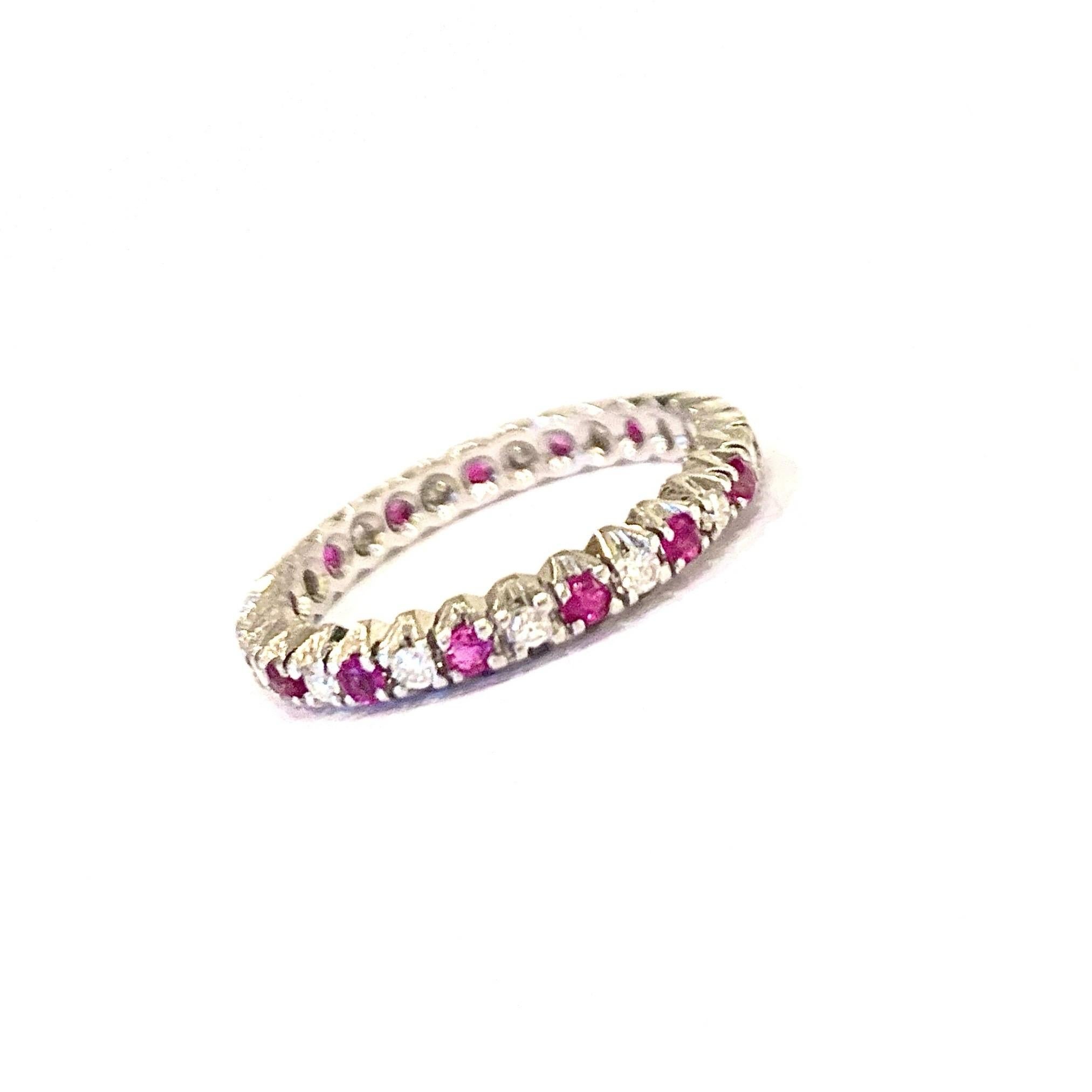 Elegant wedding band in white gold set with rubies and diamonds in full turn.

Total weight of diamonds: 0.15 carats

Total weight of rubies: 0.15 carats

Finger size: 52 (US size: 6)

18 karat white gold, 750/1000ths