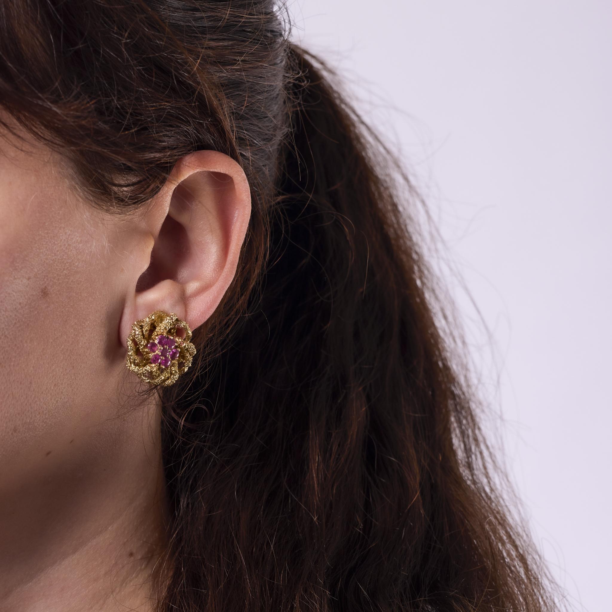 These vintage earrings by Kigu are crafted in 14k yellow gold and set with fourteen round brilliant cut rubies totaling approximately 1.50 carats. Bold and richly colored, the 1960s design showcases Kigu’s signature craftsmanship. Signed and marked