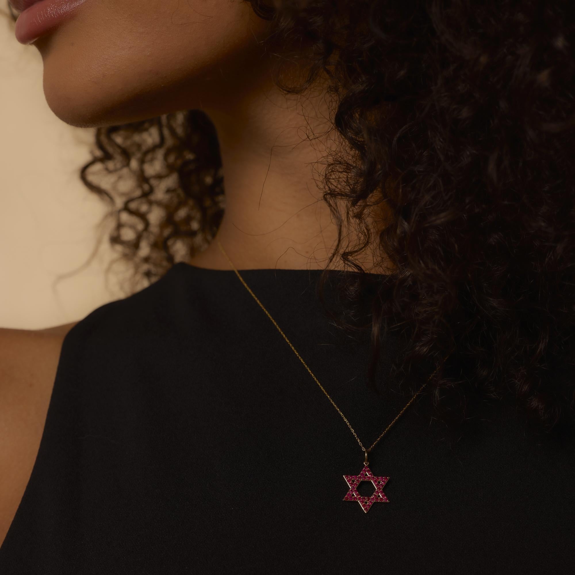 This vintage necklace glows with 48 round cut rubies set in a radiant 14k yellow gold pendant, suspended on a 20-inch chain for refined charm.
