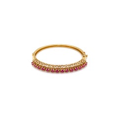 Bracciale aperto con cerniera in oro giallo 14 carati e rubino d'epoca, circa anni '80