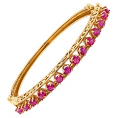 Bracelet à charnière en or jaune 14 carats et rubis vintage, circa 1980