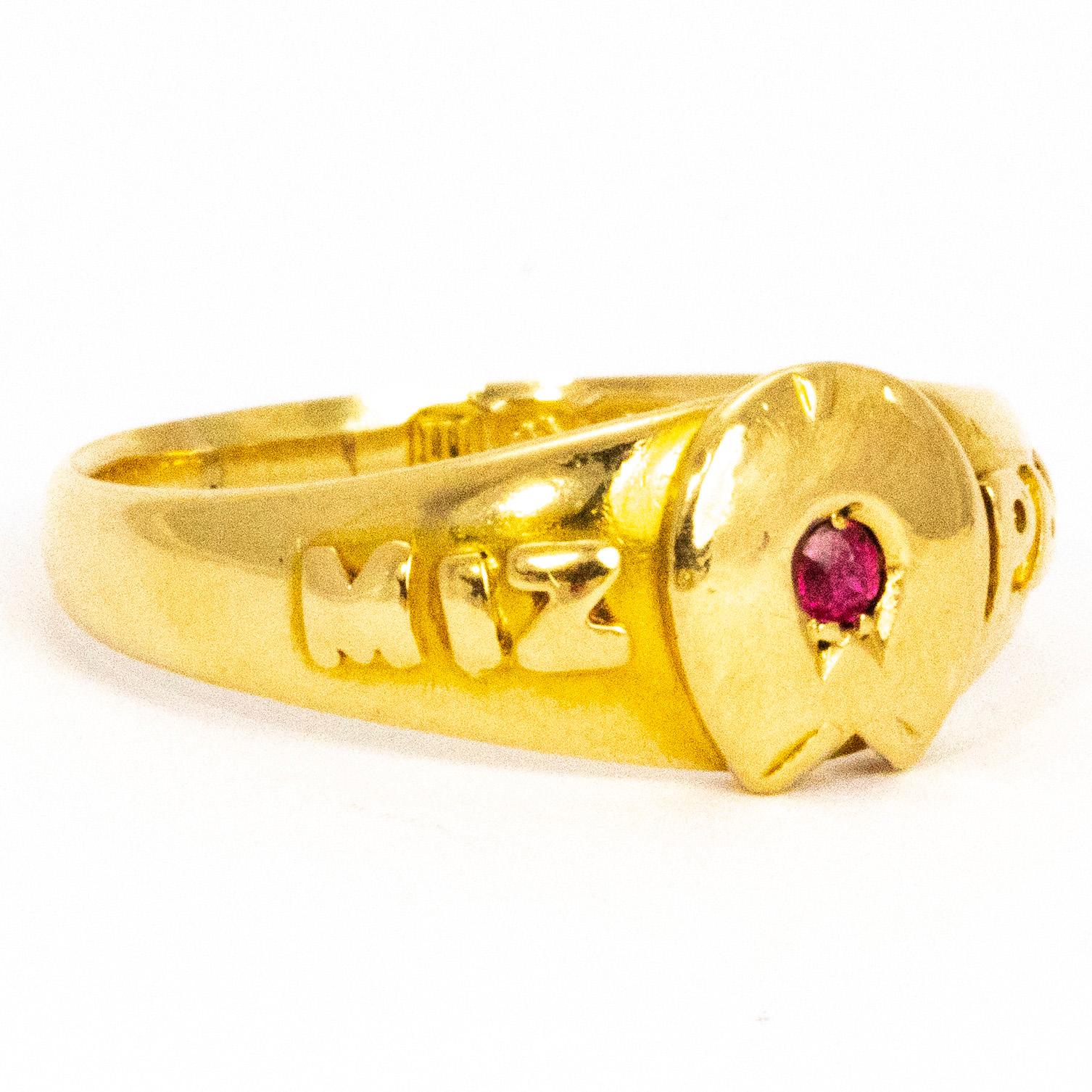 Mizpah is a Hebrew word that means 'watchtower' and is loosely interpreted as 'May God watch over you' and is still worn as a token of love or friendship. At the centre of the ring holds a ruby measuring 4pts and the chunky 18ct gold has a very