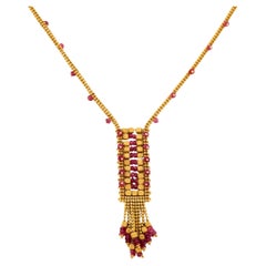 Collar vintage de rubíes y cuentas de oro amarillo de 18k