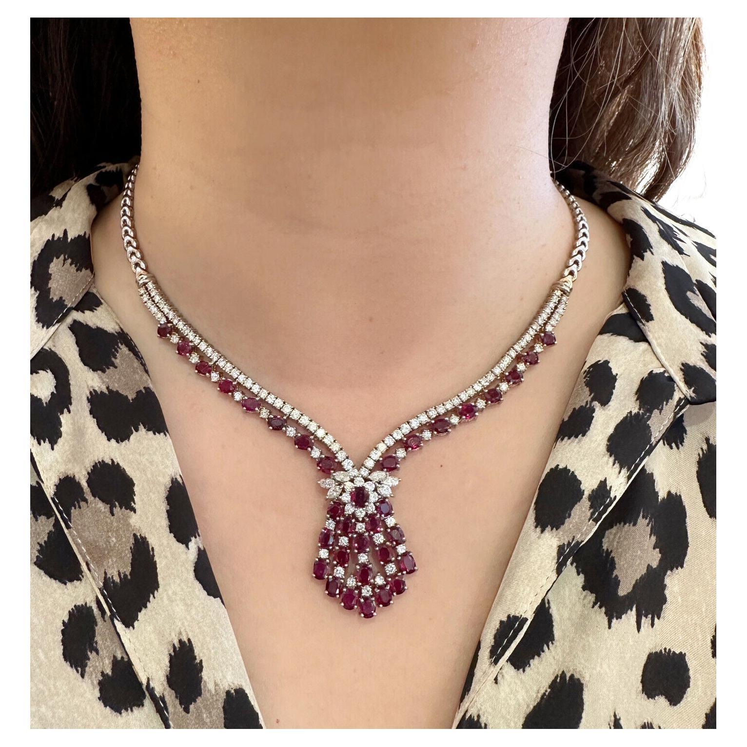Vintage Ruby and Diamond Necklace in 18k White Gold 

Ruby and Diamond Necklace features Oval Red Rubies set in Tassel Design accented with Round Brilliant and Marquise Diamonds in 18k White Gold.

Total weight of stones is approximately 10.00