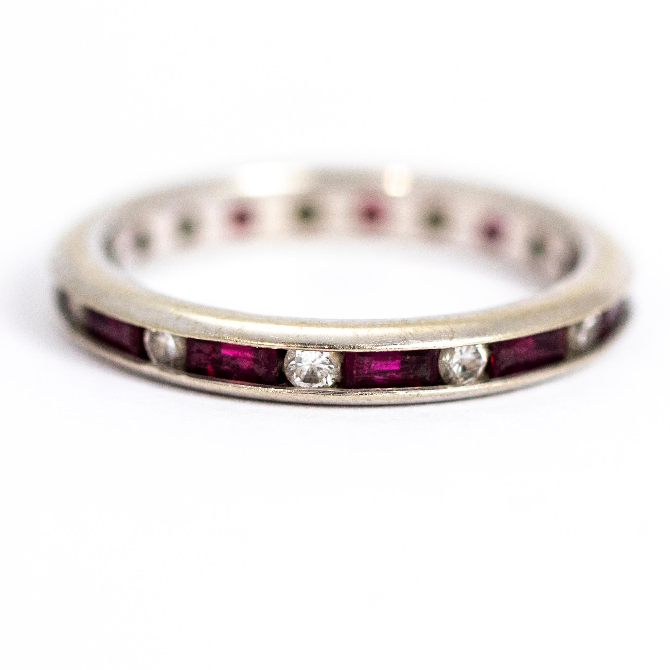 This stunning eternity band boasts sparkles all round with baguette rubies and diamonds. Modelled out of 14ct white gold and made in England.

Ring Size: O or 7 1/4