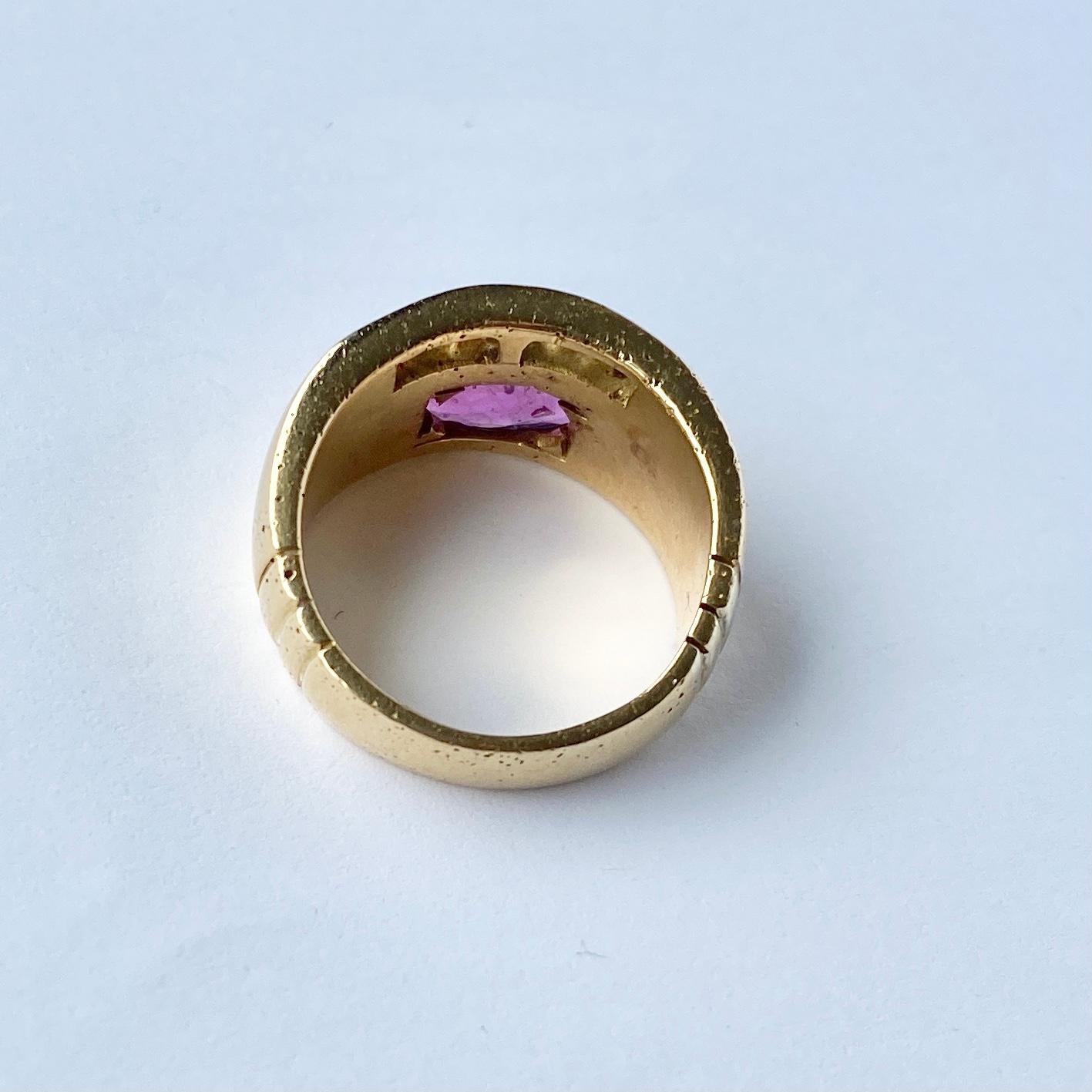 This chunky 18ct gold band holds a large natural ruby measuring approx 2ct and a row of gorgeous princess cut diamonds totalling 1.2ct. 

Ring Size: O or 7 1/4 
Band Width: 12mm

Weight: 13g