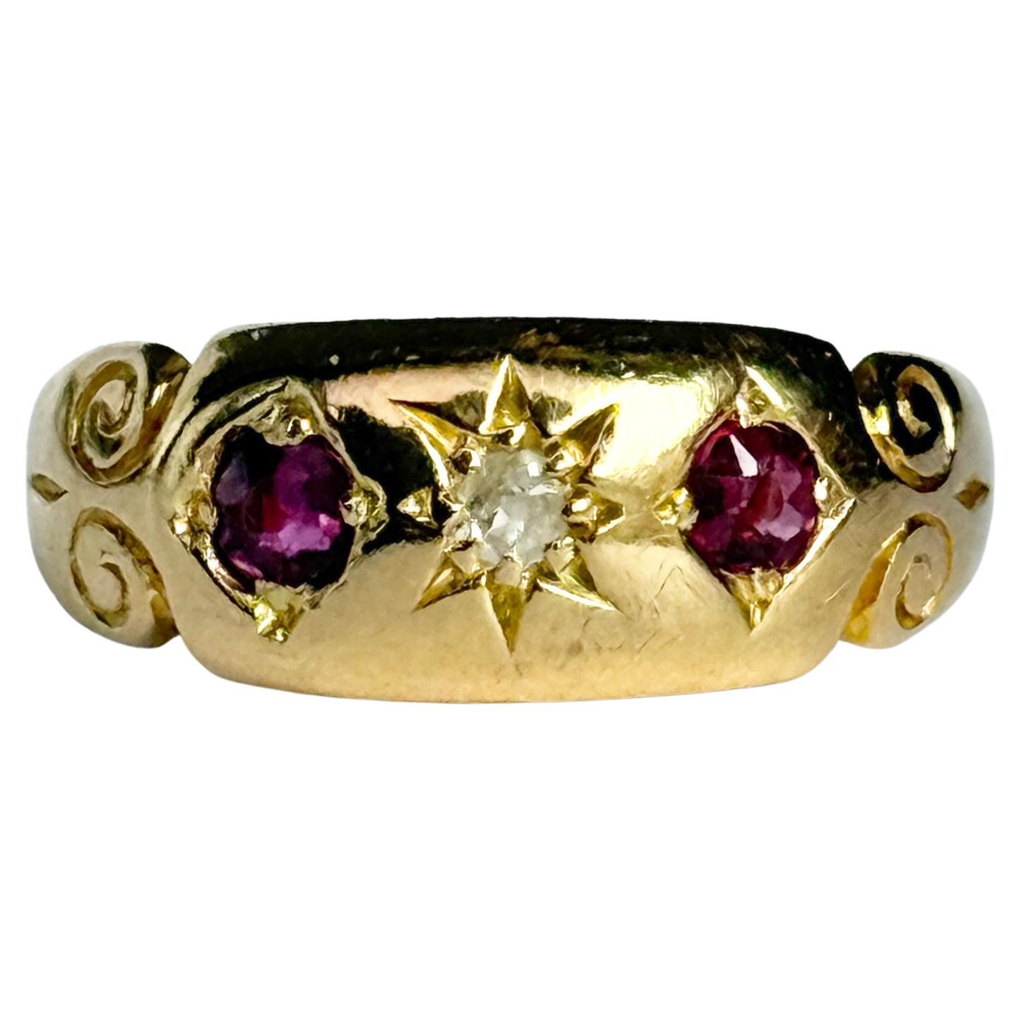 Anillo vintage de oro de 18 quilates con rubí y diamantes y engaste en estrella de tres piedras