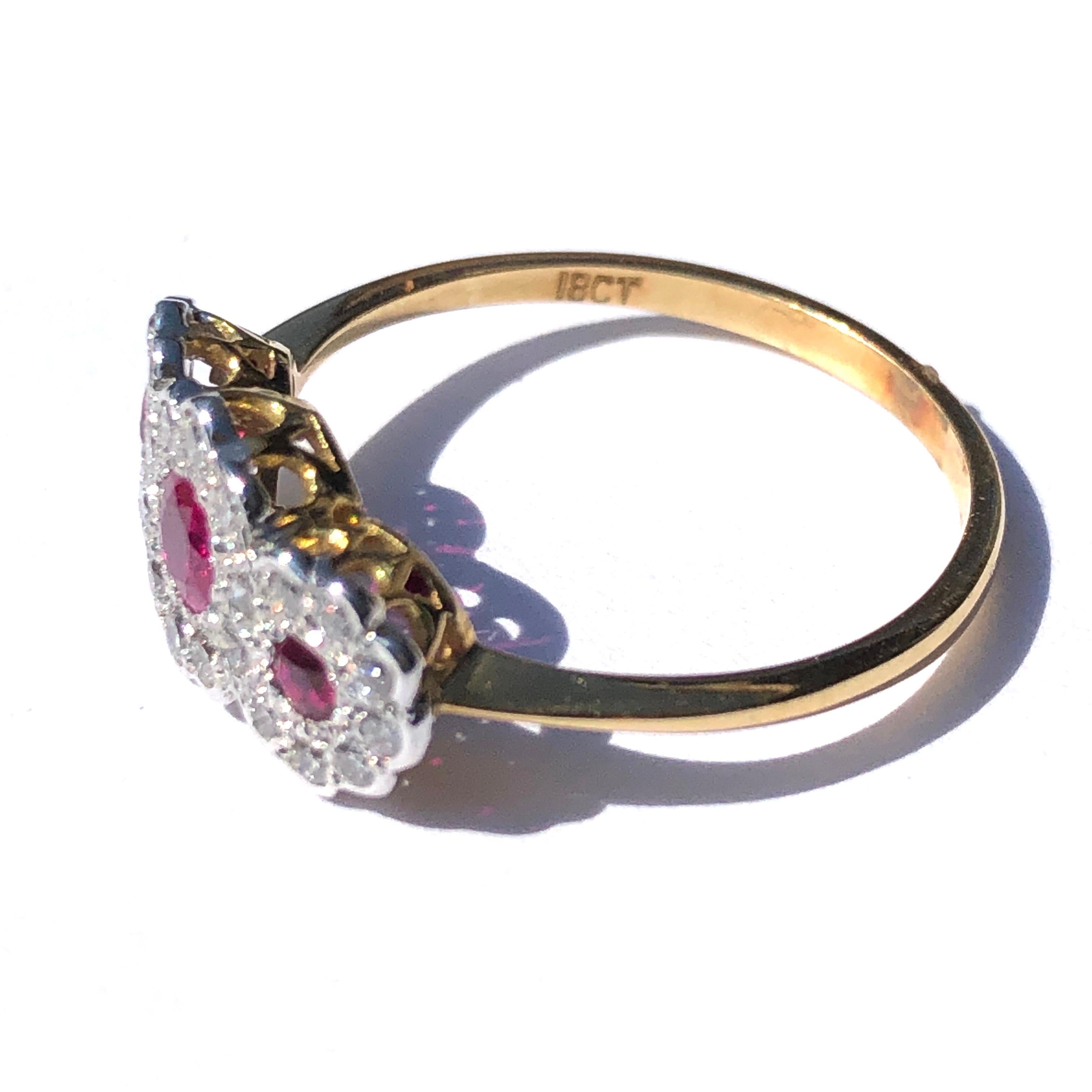 The sparkle of this ring is impossible to catch in a photo! It is simply stunning! The rubies at the centre of each cluster are a deep, rich pink colour and are all round cut, the diamonds total 20pts each and surround each ruby adding so much