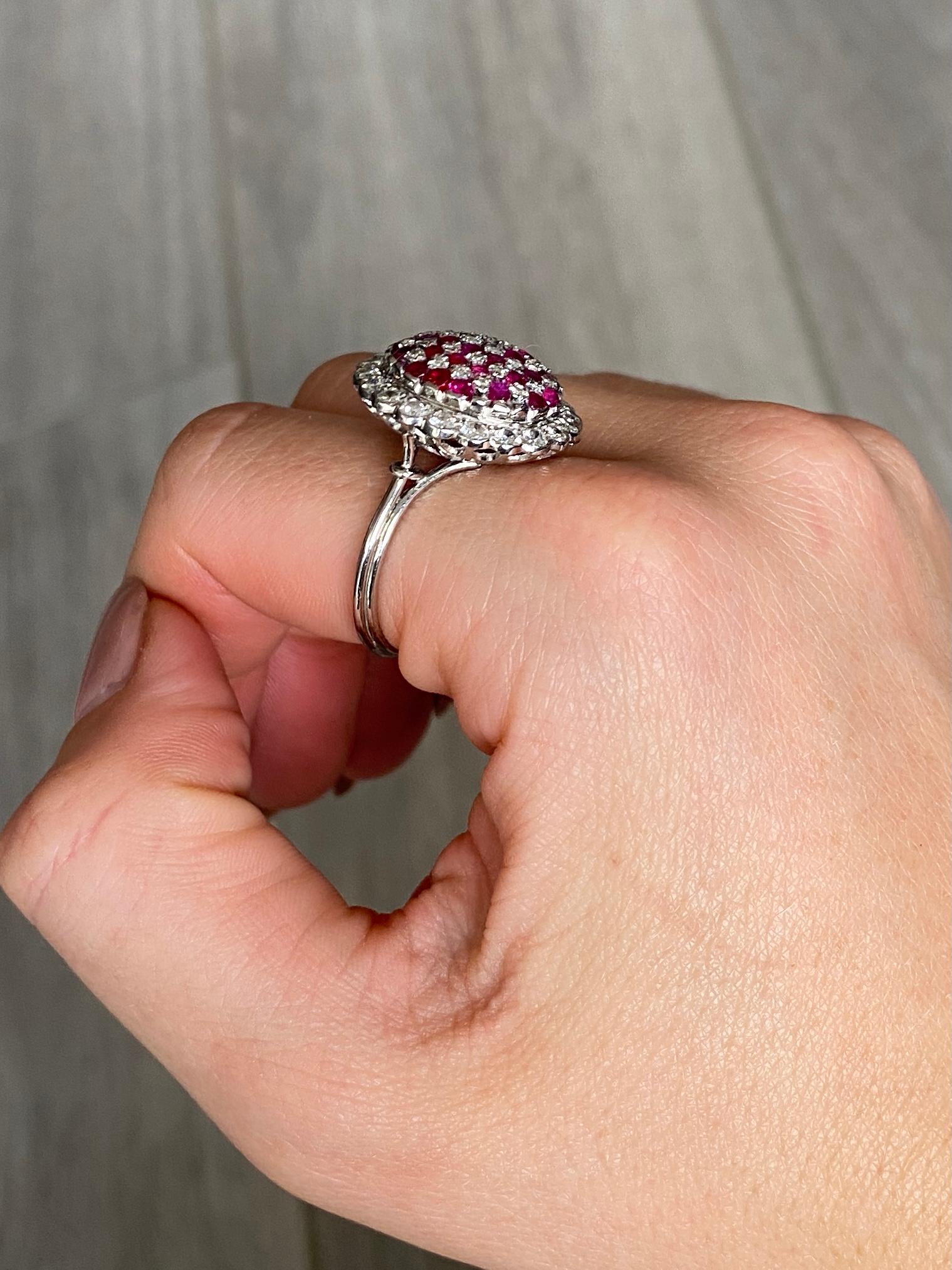 This gorgeous ring holds a total of approx 1ct of bright rubies and approx 1.2ct of round brilliant cut diamonds. Modelled in 18carat white gold. 

Ring Size: S or 9
Height From Finger: 9.5mm
Bombe Dimensions: 20x19mm 

Weight: 9.4g