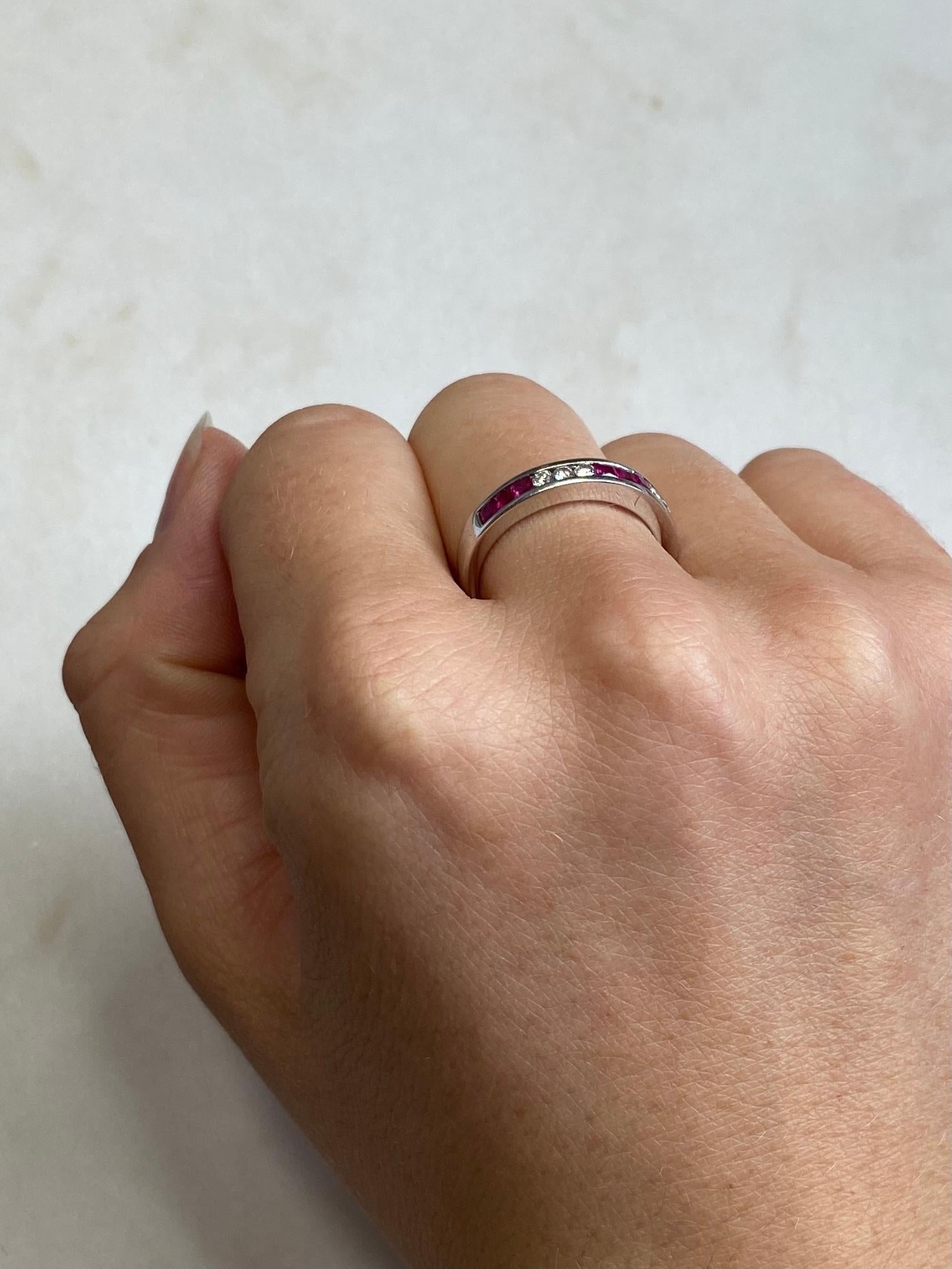 The stones are gorgeous in this band. The rubies are square cut and measure 5pts each and in-between these trios of pink stones are bright round cut diamonds measuring 4pts each. 

Ring Size: M 1/2 or 6 1/2 
Band Width: 3.5mm

Weight: 3.8g

