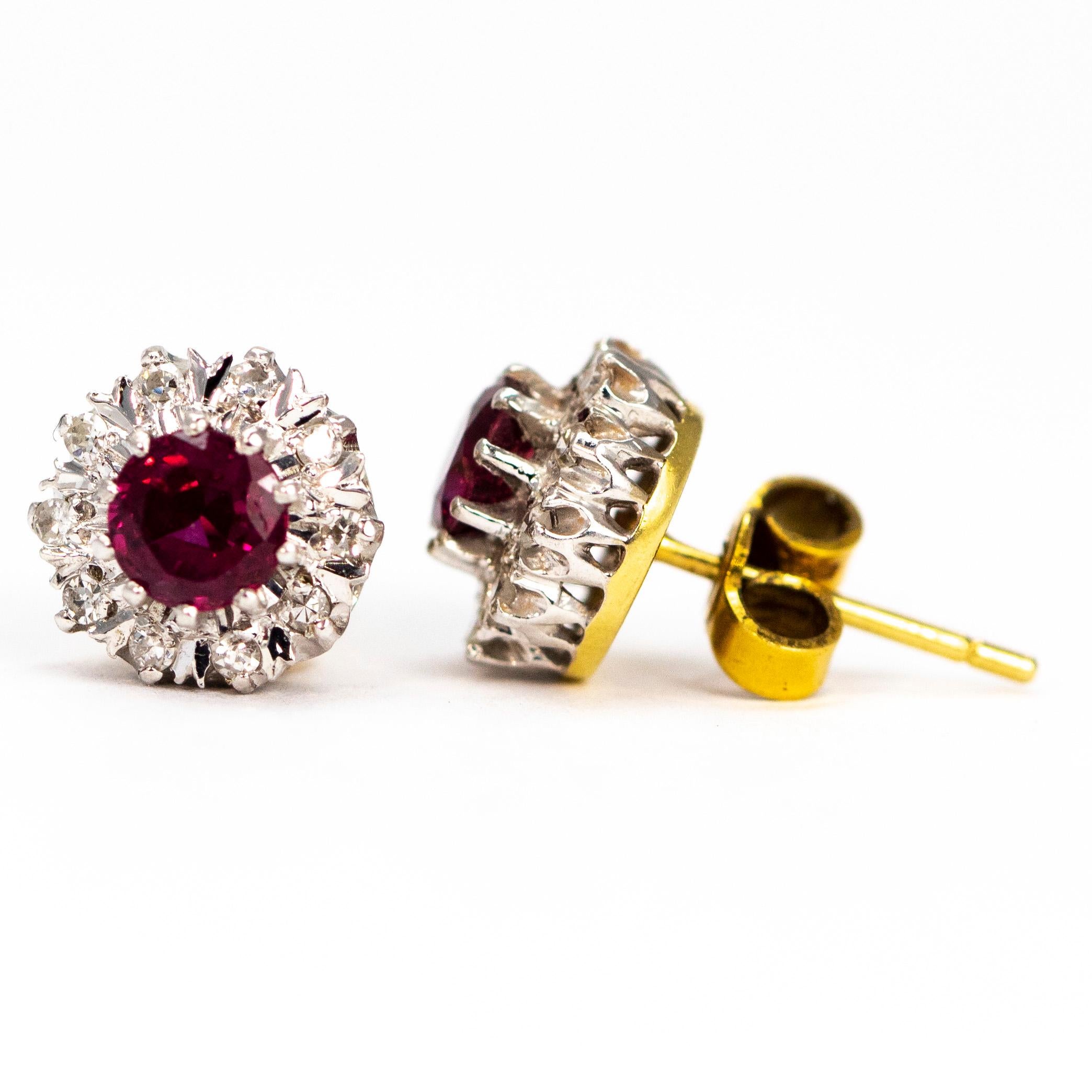 The 40pt rubies at the centre of these clusters are a beautiful deep, rich pink colour and are surrounded by a halo of glistening diamond points. All the stones are set in platinum and the back of the earrings are modelled in 18ct gold. 

Cluster