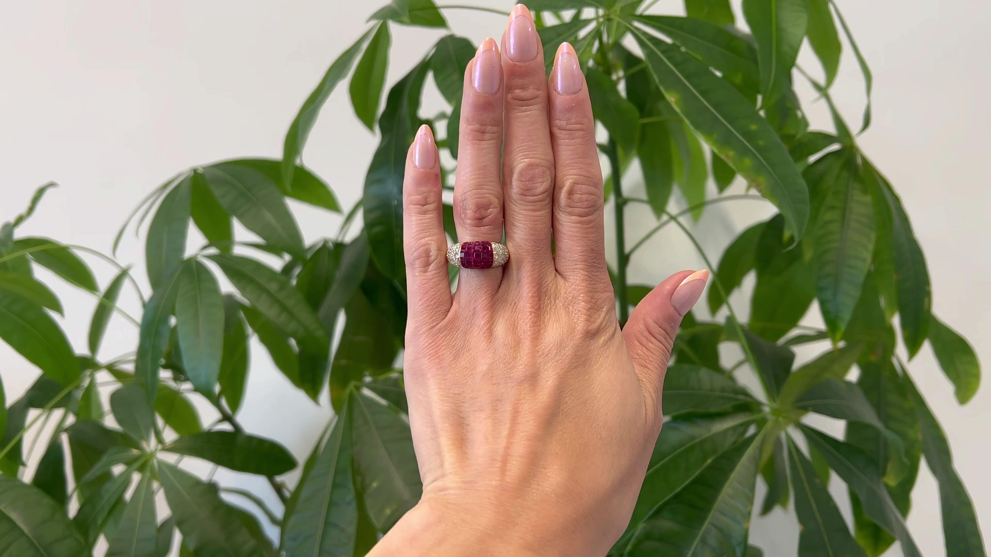 One Vintage Ruby and Diamond 18k Yellow Gold Invisible Set Dome Ring. Featuring 35 calibré cut rubies with a total weight of 2.77 carats. Accented by 62 round brilliant cut diamonds with a total weight of 1.42 carats, graded near-colorless, VS-SI