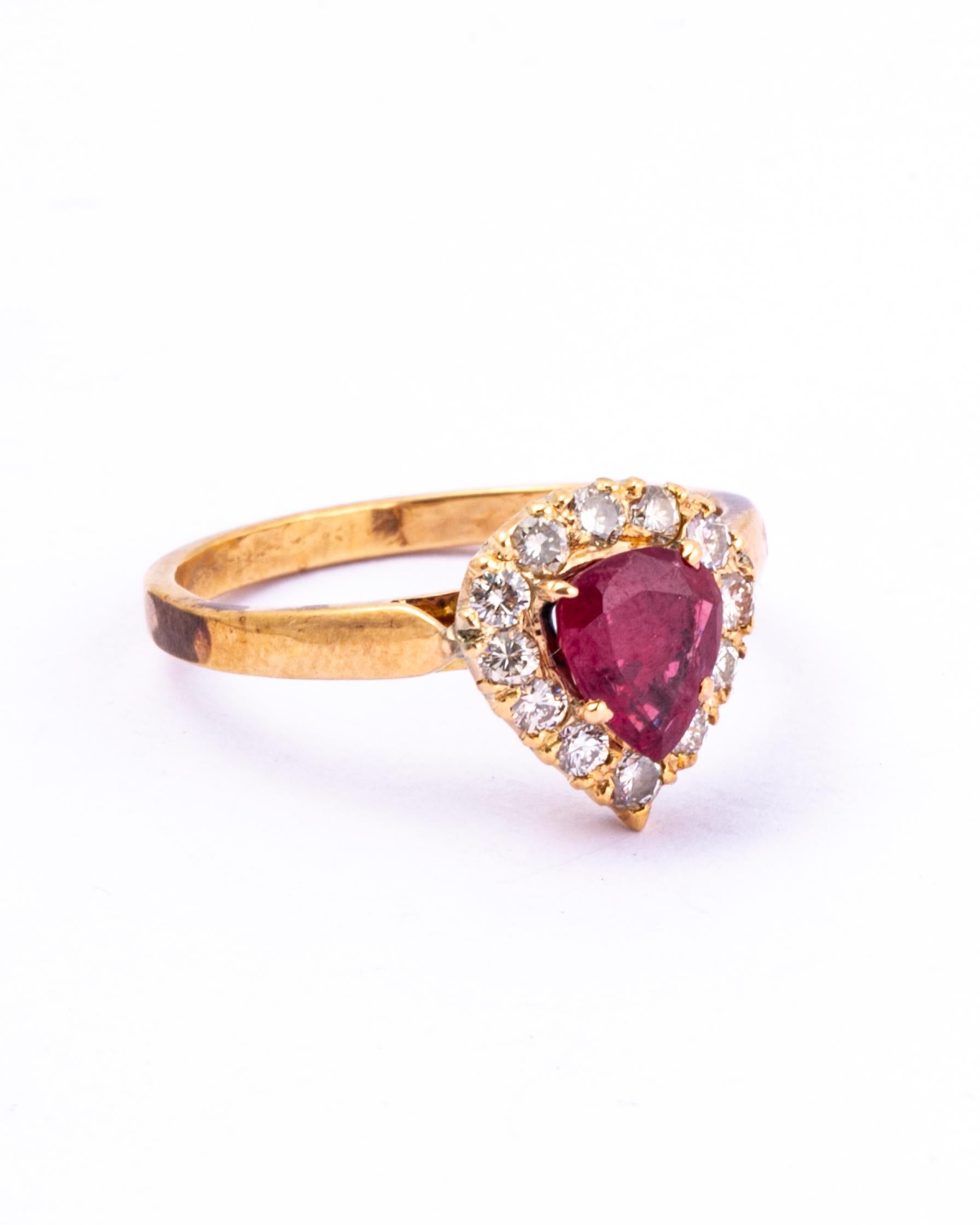 This gorgeous pear shaped ruby and diamond cluster has a heart shaped feel to it. The diamonds are bright and sparkling and the ring is modelled in 9 Carat Gold. 

Ring Size: N 1/2 or 7 
Cluster Dimensions: 10x10

Weight: 2.7g