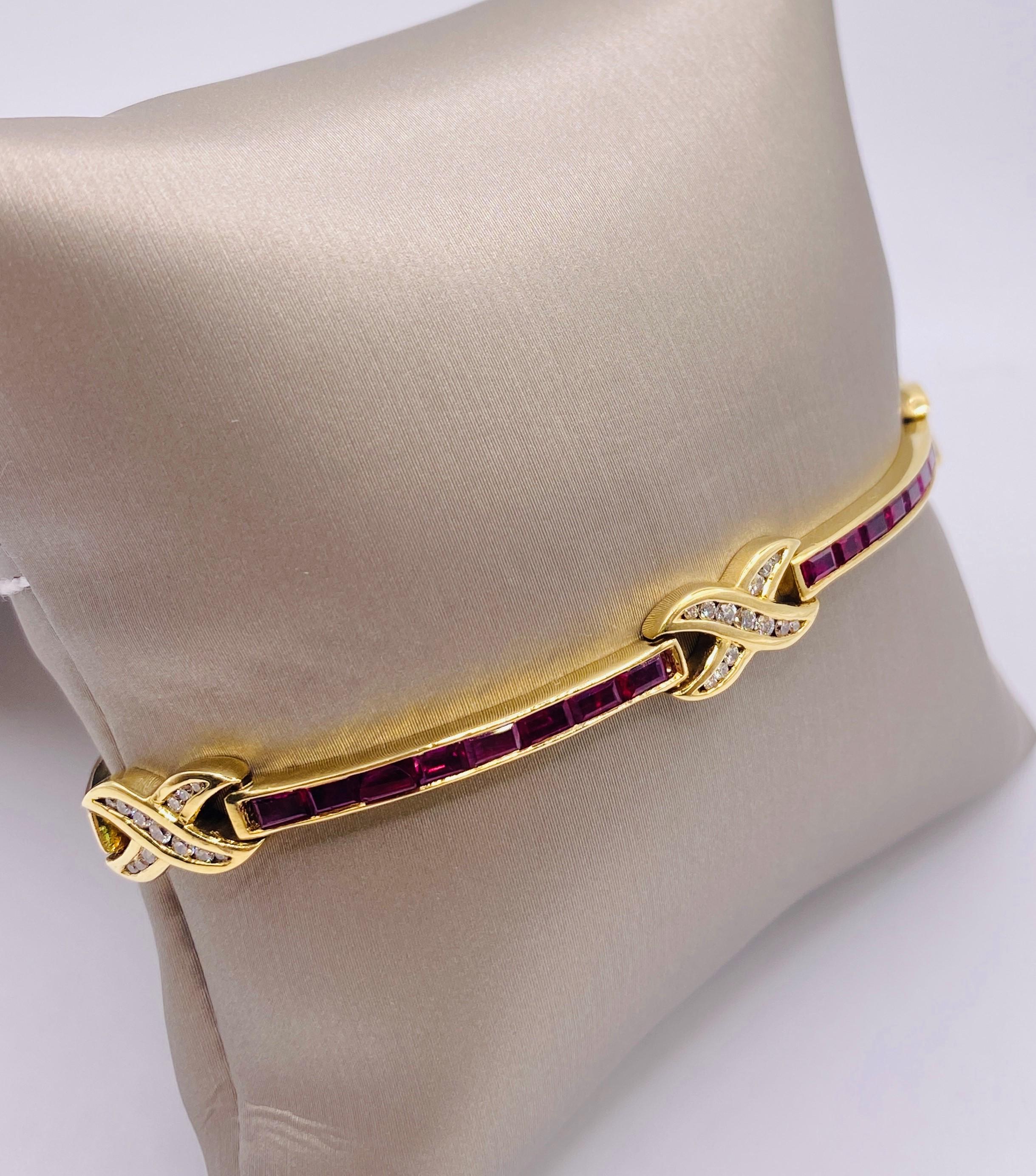 18k yellow gold 3.85 carat total weight channel-set baguette rubies and 0.50 carat total weight round brilliant cut diamond bracelet.10.8Dwt. 8