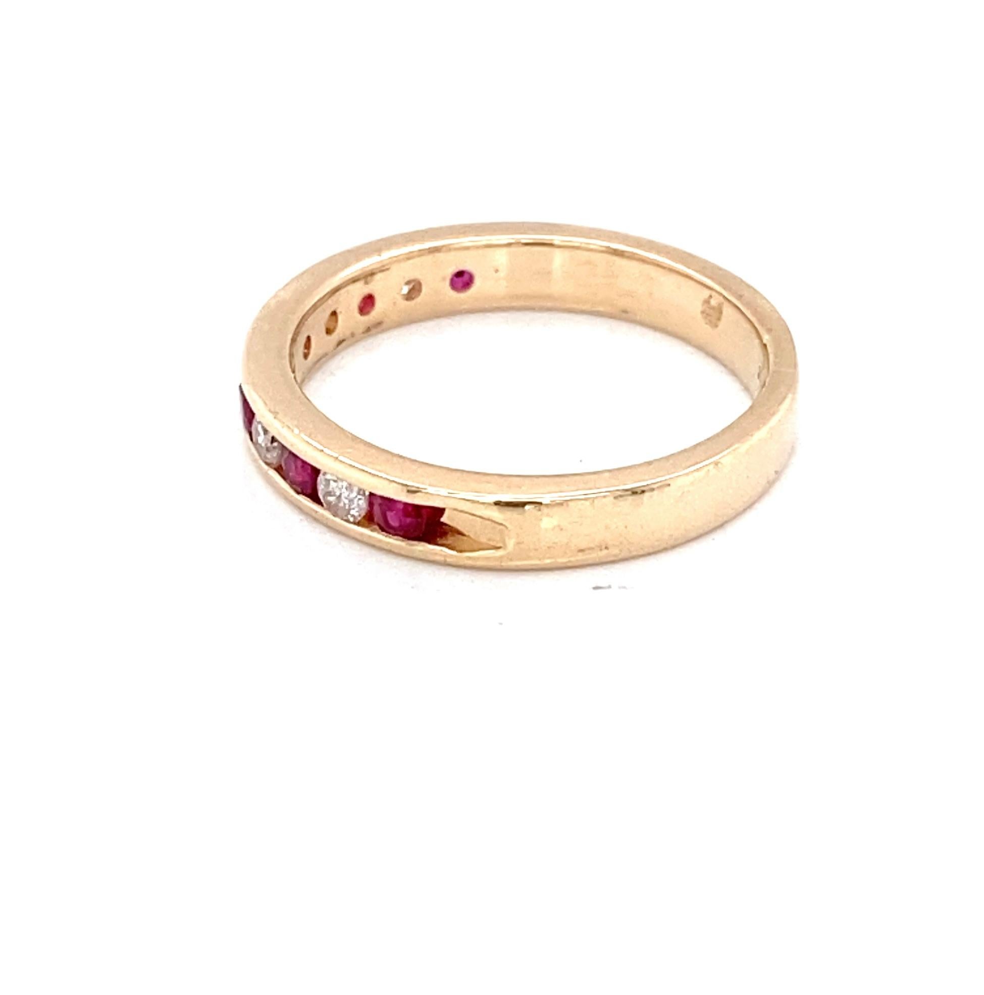 Contemporary Vintage Ruby and Diamond Channel Set 14 Karat Yellow Gold Band For Sale