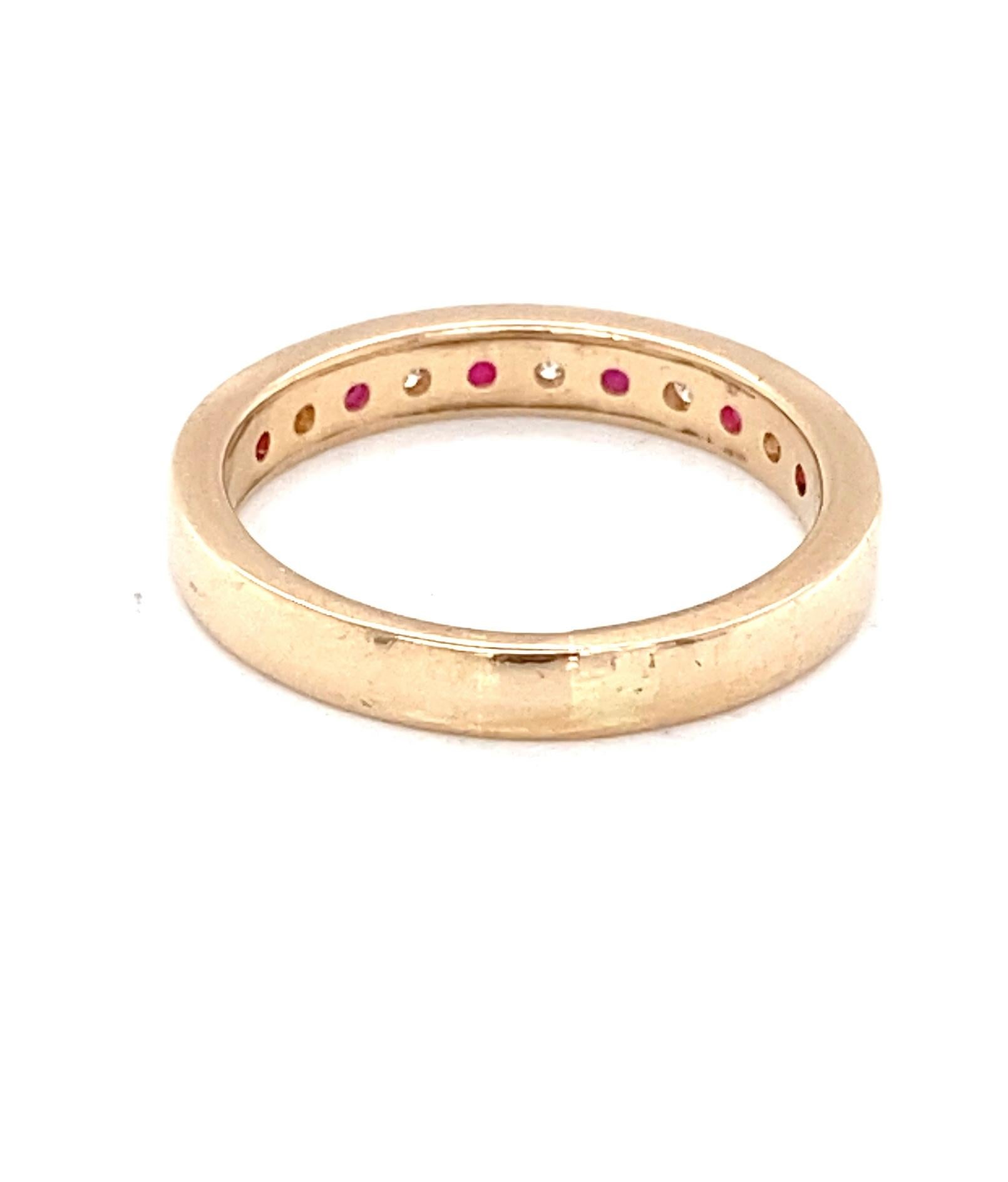 Round Cut Vintage Ruby and Diamond Channel Set 14 Karat Yellow Gold Band For Sale