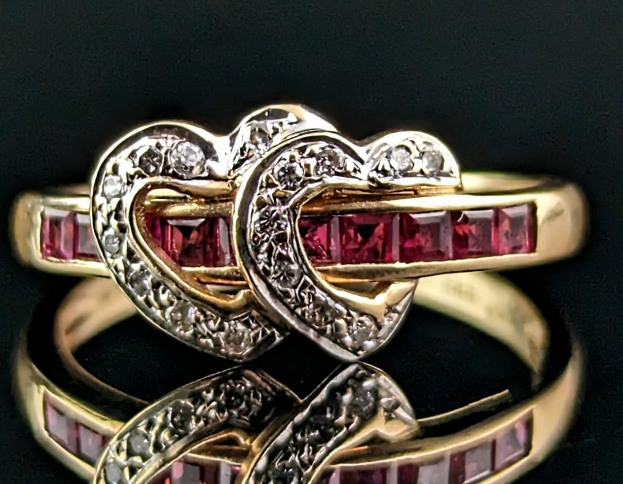 How sweet is this vintage Ruby and Diamond double love heart ring?!

The ring has a half eternity style with caliber cut rubies channel set to the front with two interlocking diamond set love hearts looped over the band.

A truly beautiful piece