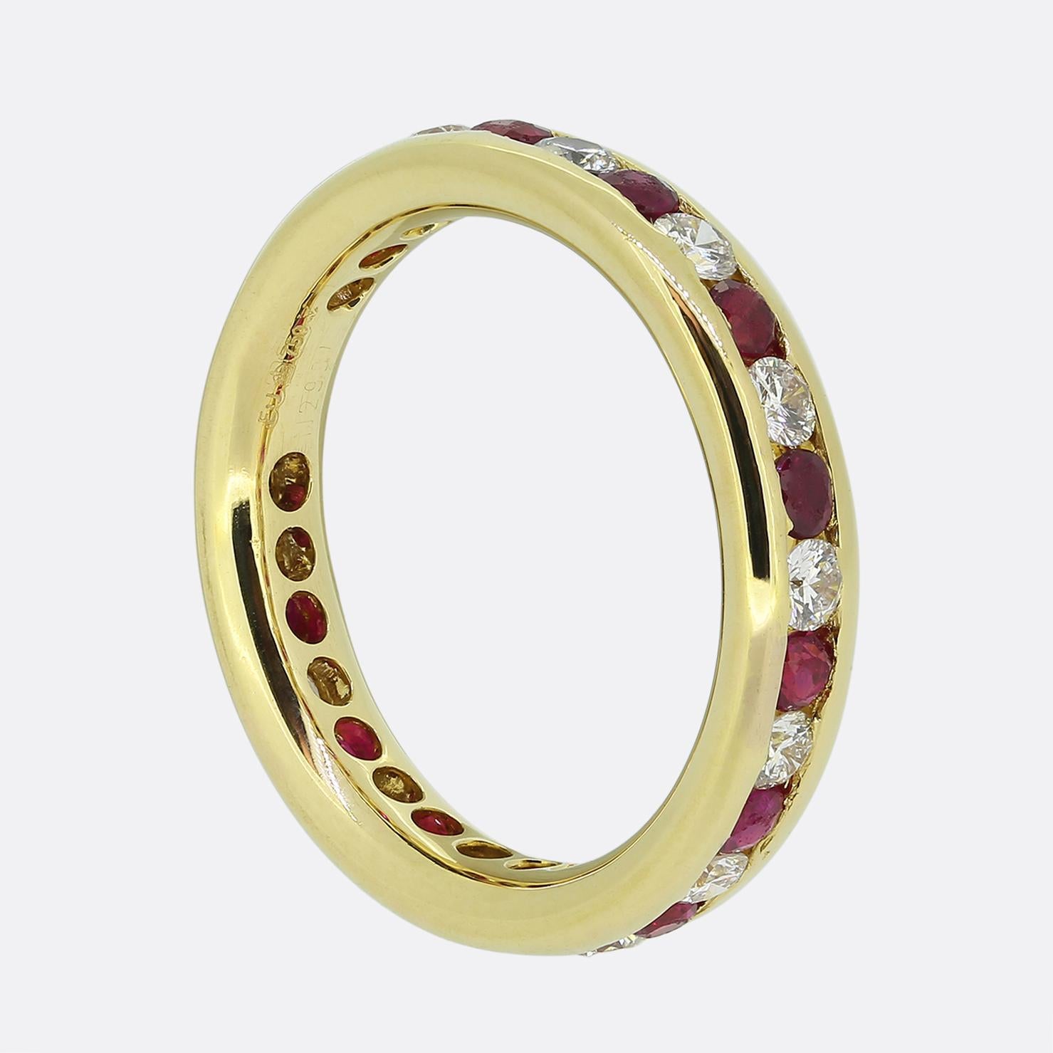 Here we have an lovely ruby and diamond eternity ring. This vintage piece has been crafted from 18ct yellow gold and showcases an alternating array of rich red rubies and bright white round brilliant cut diamonds; each of which has been expertly