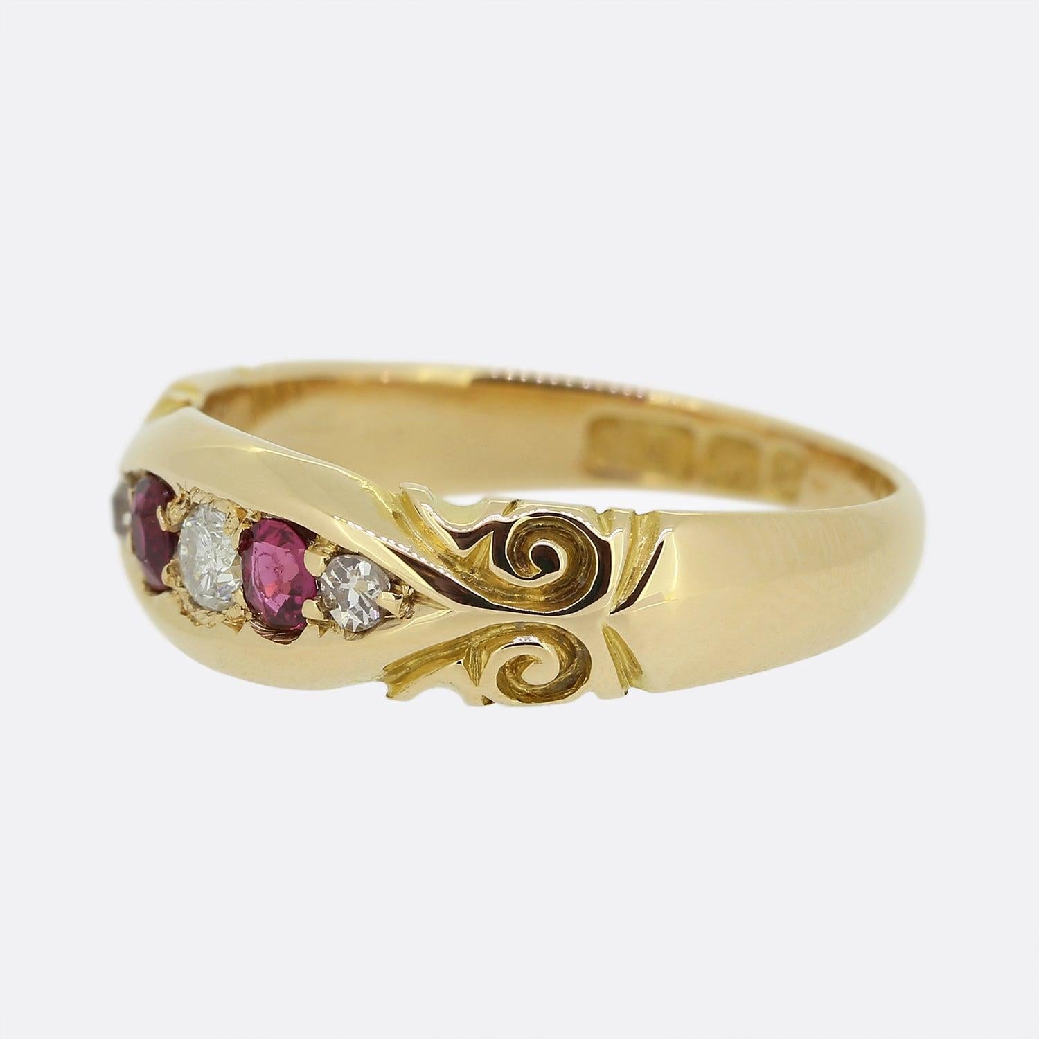 Here we have a vintage ruby and diamond five-stone ring borrowing from a Victorian style. A boat shaped face plays host to a single round brilliant cut diamond which flanked on either side by a round ruby and old cut diamond. Each stone here has