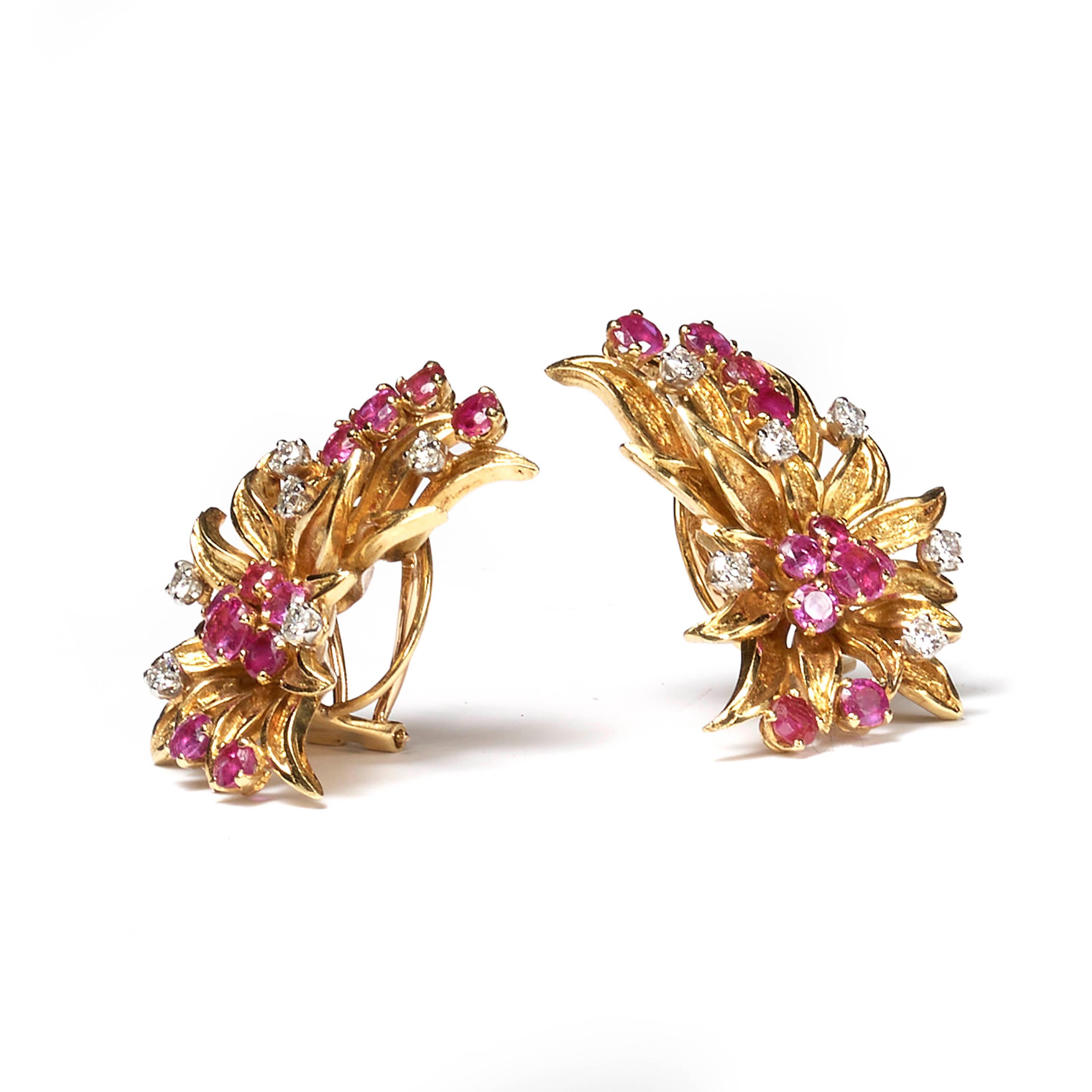 A pair of vintage ruby and diamond floral ear clips, designed as gold petals with interspaced round-cut rubies and round brilliant-cut diamond stamens, estimated total ruby weight 3.50ct, estimated total diamond weight 0.75ct, mounted in 18ct yellow