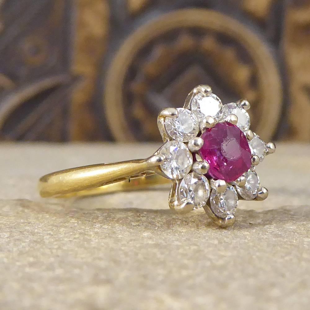 This lovely vintage Ruby and Diamond cluster ring has been crafted in a floral style, bringing a splash of summer and colour to any outfit. It has been created from in 18ct White Gold leading down to an 18ct Yellow Gold band.

Diamond