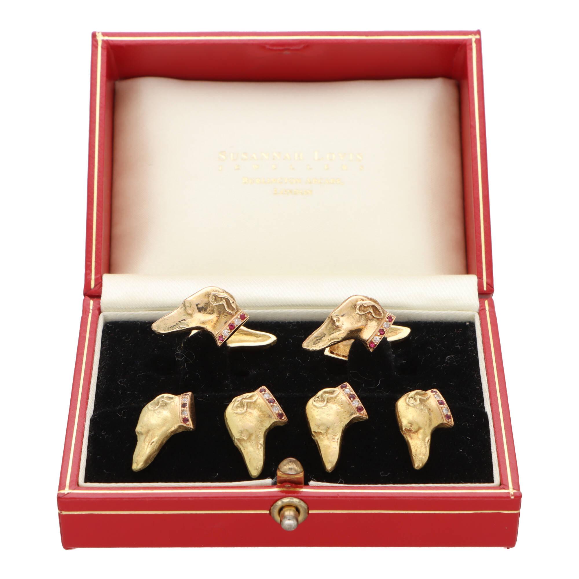 An incredibly unique ruby and diamond Greyhound cufflink and shirt stud dress set, made in 18k yellow gold. 

This beautiful set is firstly composed of a double sided pair of Greyhound cufflinks. The Greyhound faces have been beautifully handcrafted