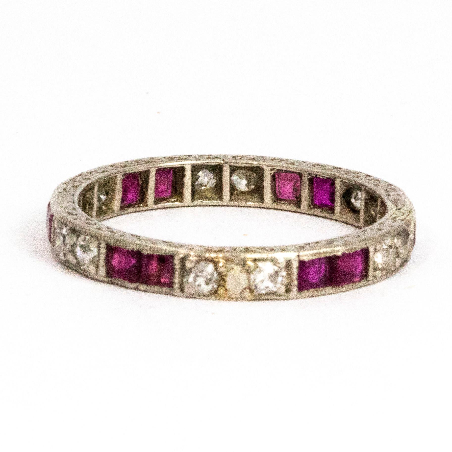 This wonderful ruby and diamond Art Deco style eternity boasts a total of 12 10pt rubies and 13 7pt diamonds. The sparkle is gorgeous and the diamonds next to the rubies make the stones pop. The stones re all set in platinum. 

Ring Size: M 1/2 or 6