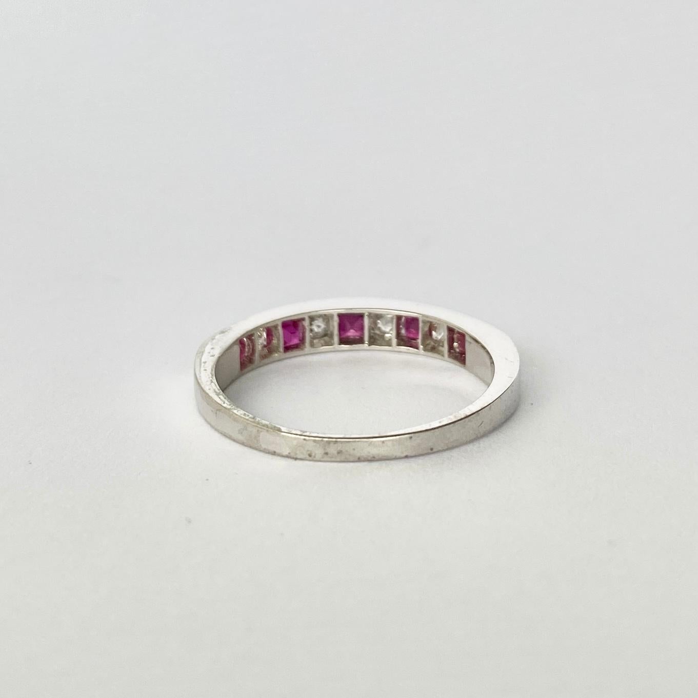 The stones are gorgeous in this band. The rubies are square cut and total 50pts and in-between these pairs of red stones are bright round cut diamonds totalling 20pts. The stones are set in platinum.

Ring Size: N or 6 3/4 
Band Width: 3mm

Weight: