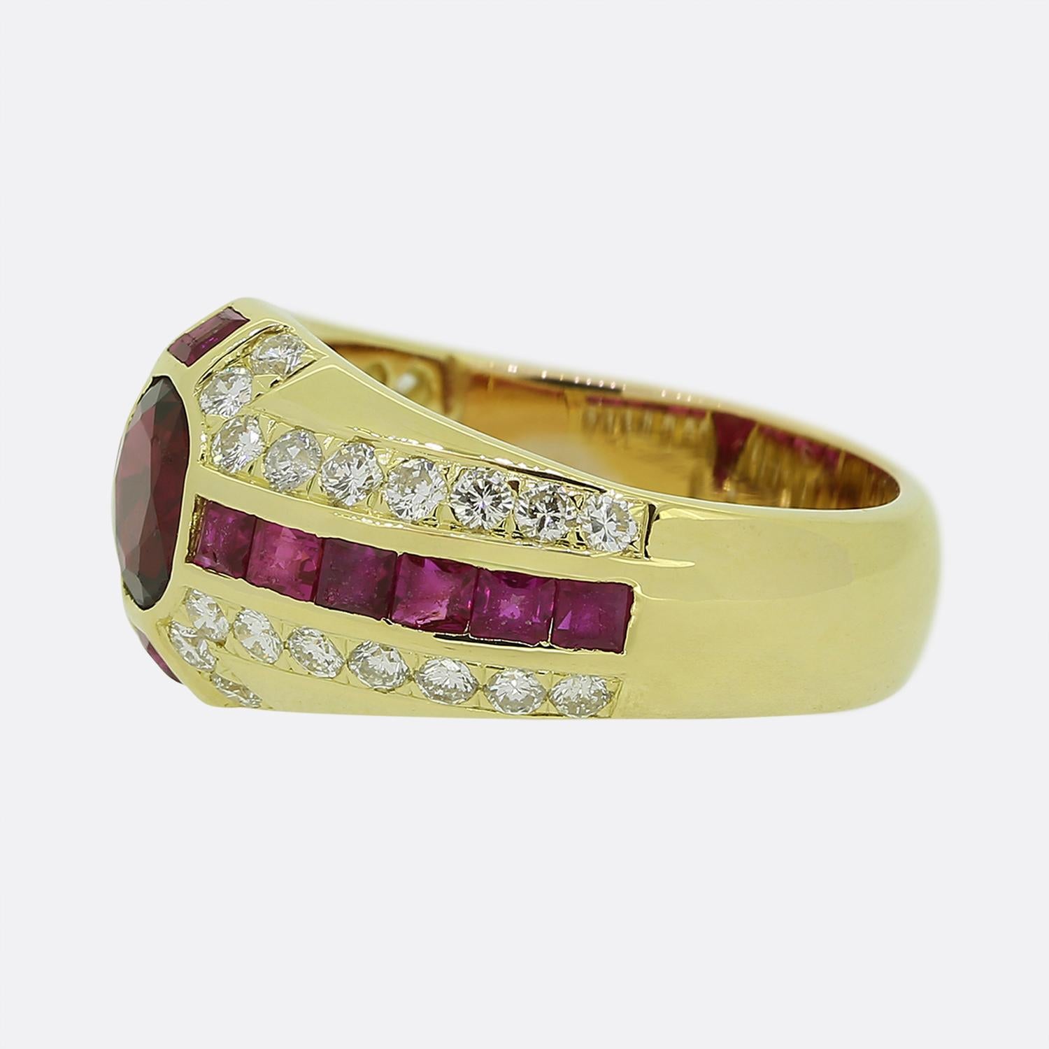 Here we have an impressive, vintage ruby and diamond ring. The focal point of the ring is a rich red ruby which is bezel set and surrounded by well matched smaller rubies and diamonds. The ring has a cross style design which could be interpreted as