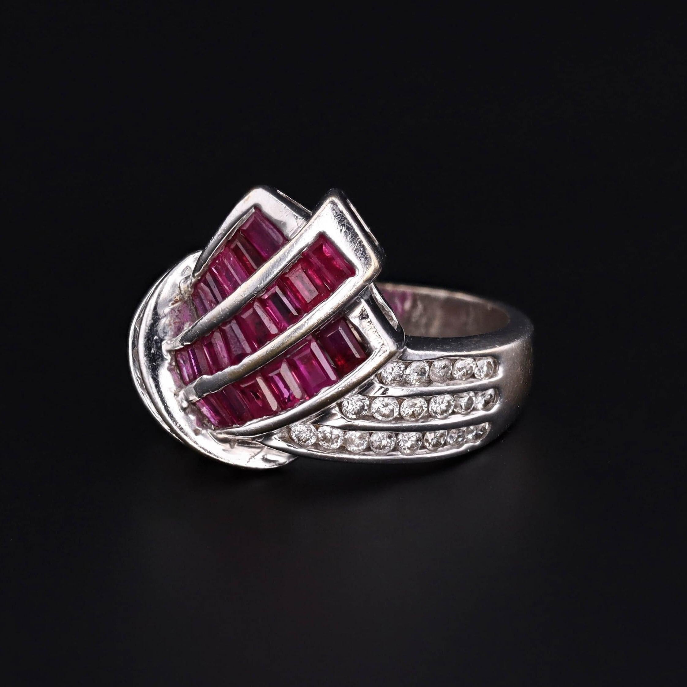 Rubies, the birthstone of July, have longstanding associations with passionate love and power.

This retro ring (circa 1940-1950) features rubies and diamonds set in 14k white gold.

The ring is in excellent condition. It is currently a size 6.75