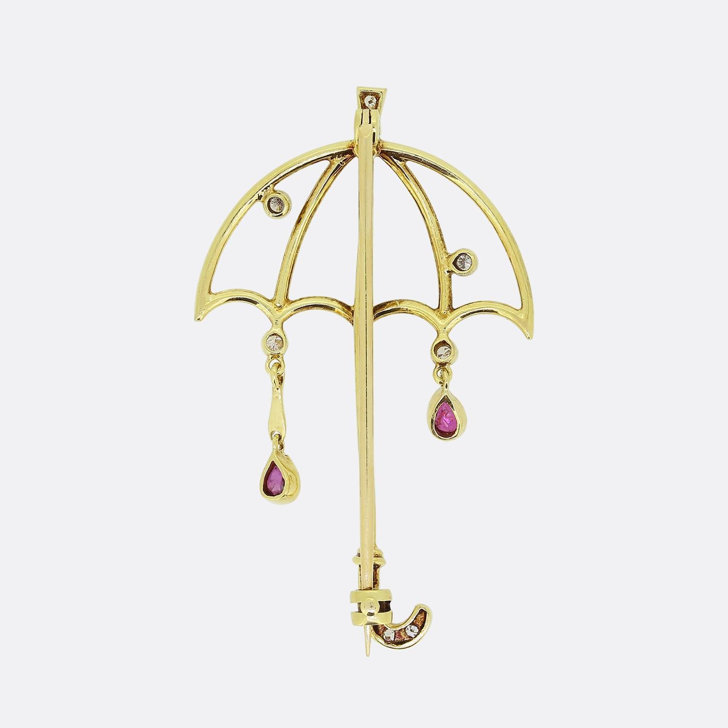 Here we we have a charming vintage brooch. This piece has been crafted from 18ct yellow gold into the shape of an umbrella. The open design here is well detailed whilst playing host to an array of sporadic round brilliant cut diamonds and a duo of