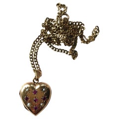 9 carat gold locket and chain Vintage Ruby and Pearl 9 Carat Gold Locket and Chain