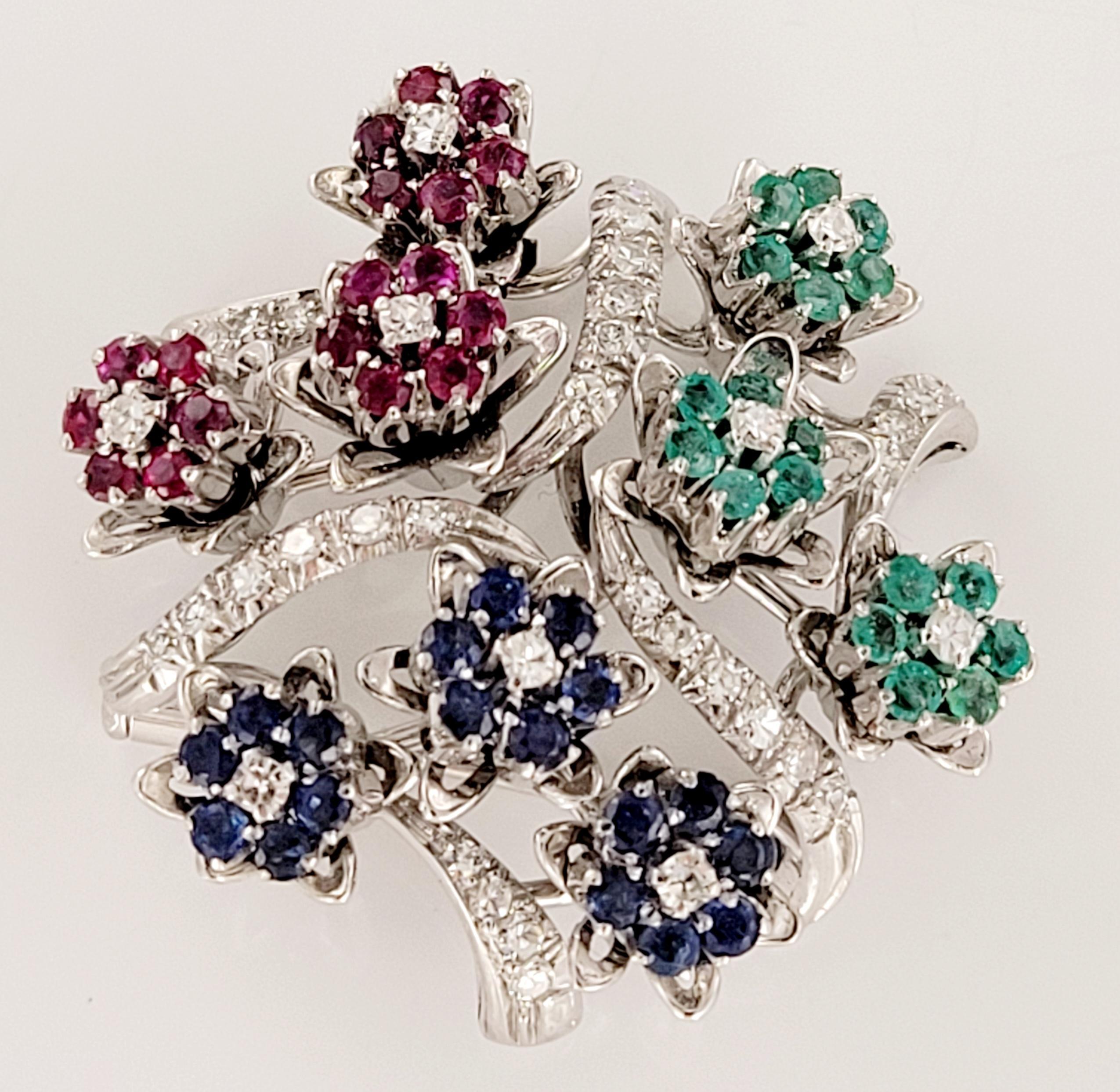 Amazing 3 gemstones and diamond vintage brooch. Emerald: 0.54 ct. Blue Sapphire: 0.50 carat weight. Ruby 0.52 carat. Dimond 0.45 carat of approximately G color and SI clarity. Set in 18K White Gold. Retail Price $4900