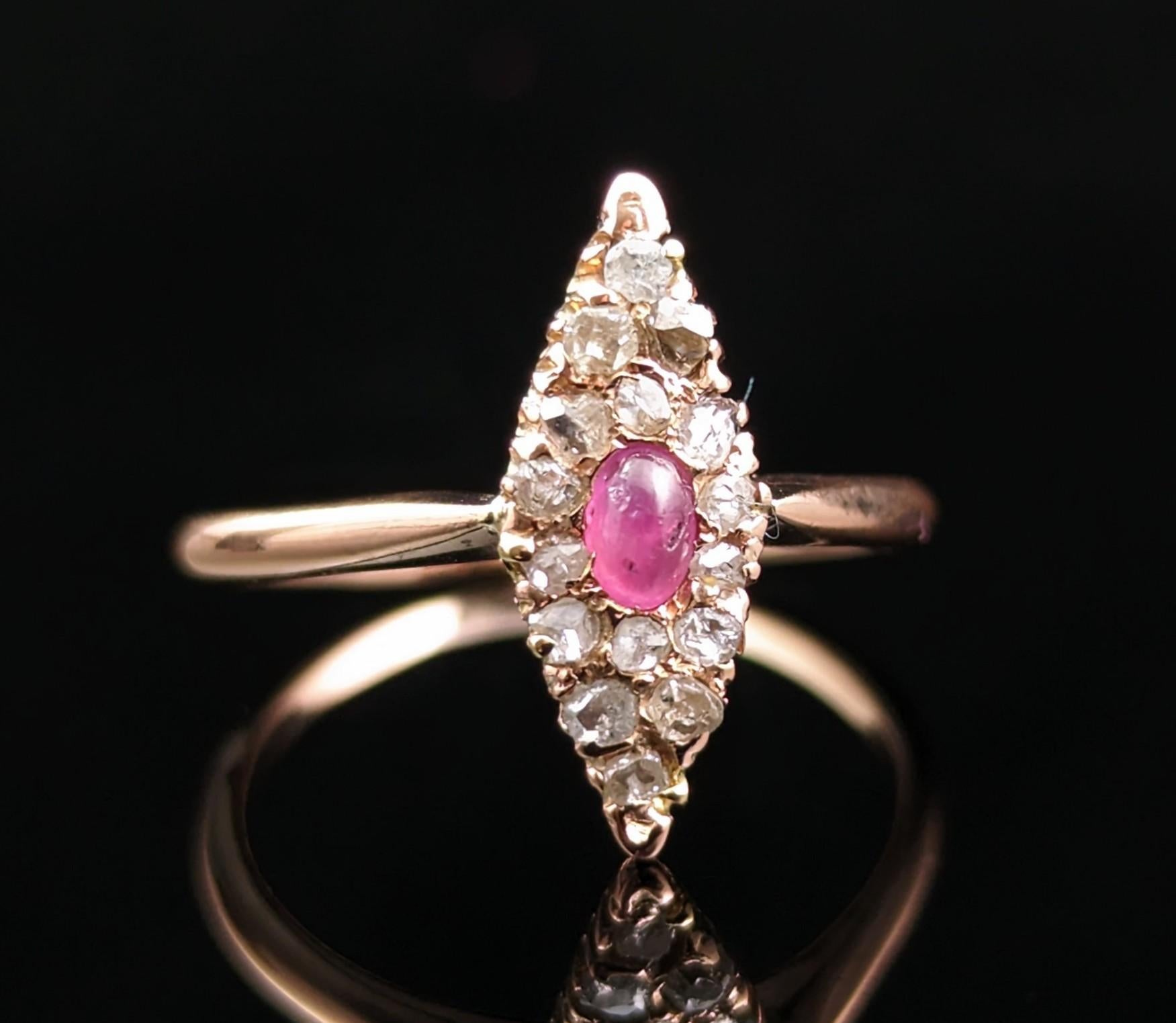 This stunning vintage Ruby cabochon and rose cut diamond navette ring is definitely a beauty!

A central pinky red cabochon ruby surrounded by lashings of twinkling rose cut diamonds, the diamonds giving that beautiful mystical twinkle in low light
