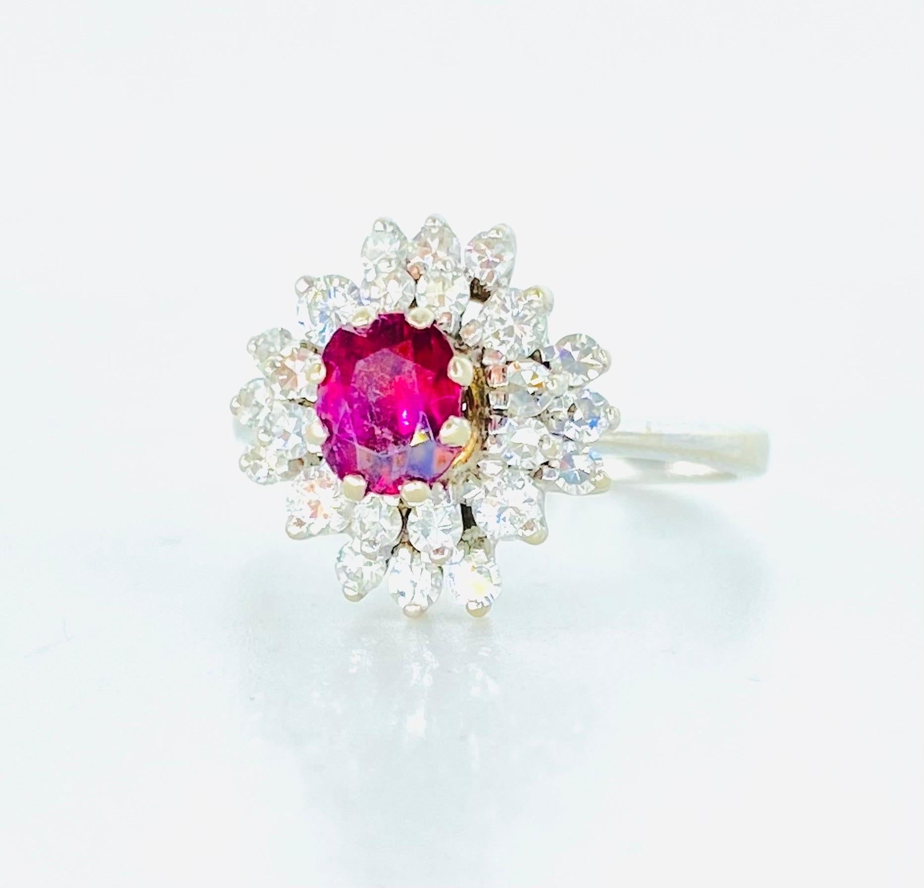Vintage Ruby Center and Diamonds Surrounding Cluster Ring 18k White Gold. The ring measures 13mm By 12.80mm. Beautiful sparkling with a lot of diamond life. The diamonds featured are natural old miner diamonds that weight approx total of 0.75ct. The