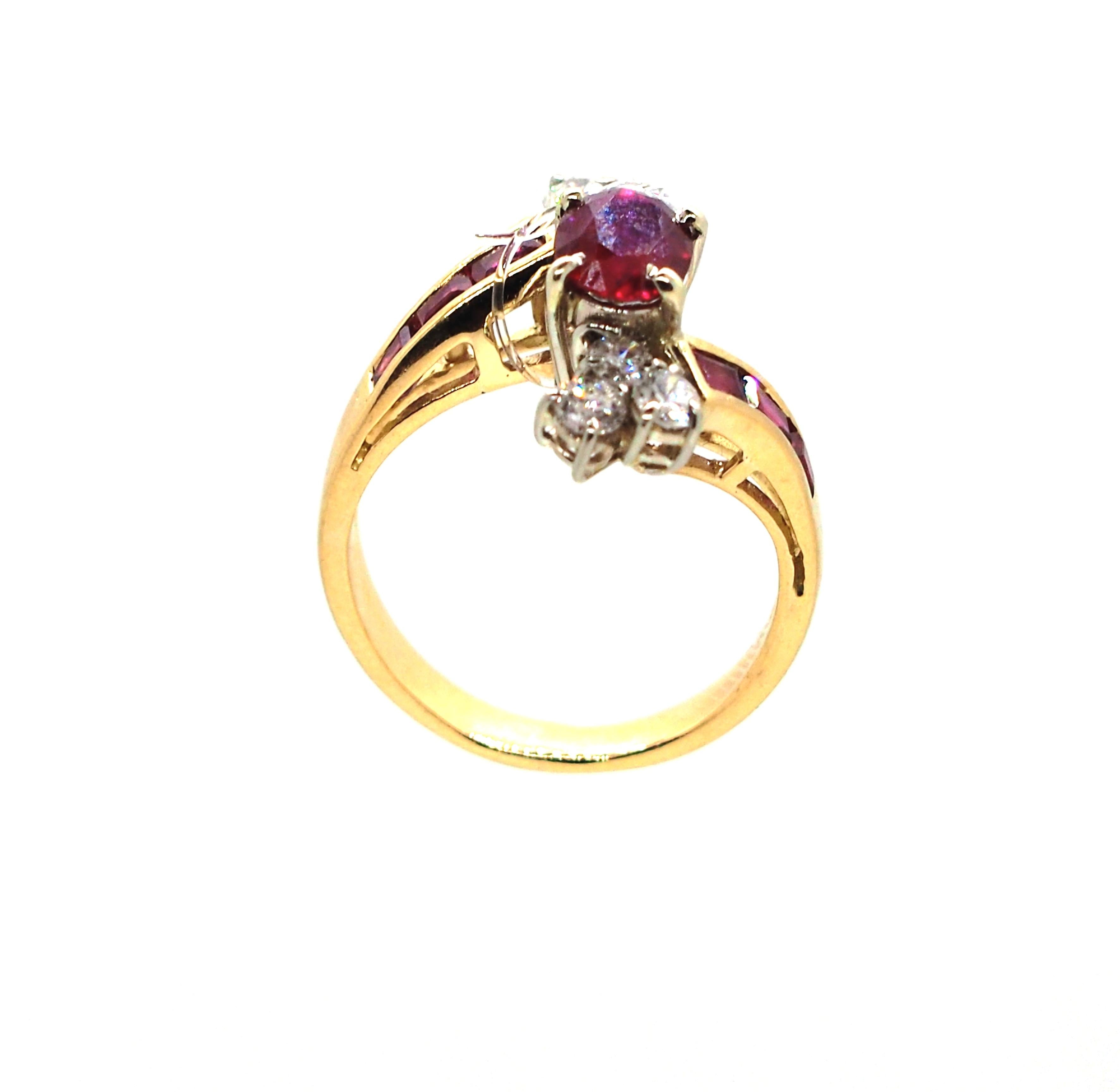 Introducing a ruby ring with an oval and baguette rubies and 6 diamonds is a stunning piece of jewelry that combines the rich color of rubies with the sparkle of diamonds approximately 0,6 carat. The centerpiece of the ring is an oval ruby that is