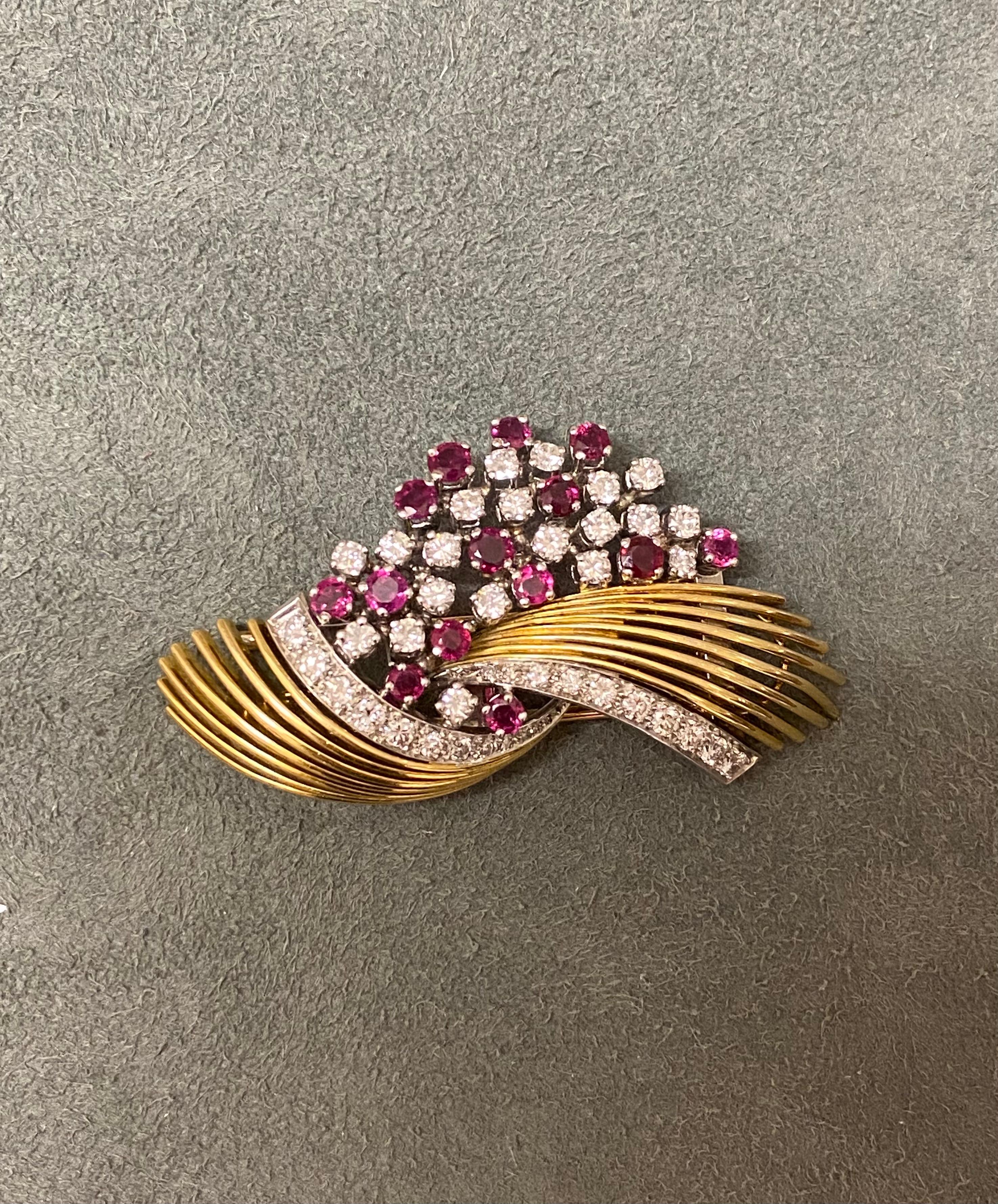A European vintage brooch in 18k yellow gold set with rubies (NH, 1.16ct total) and diamonds (1.87ct total). 