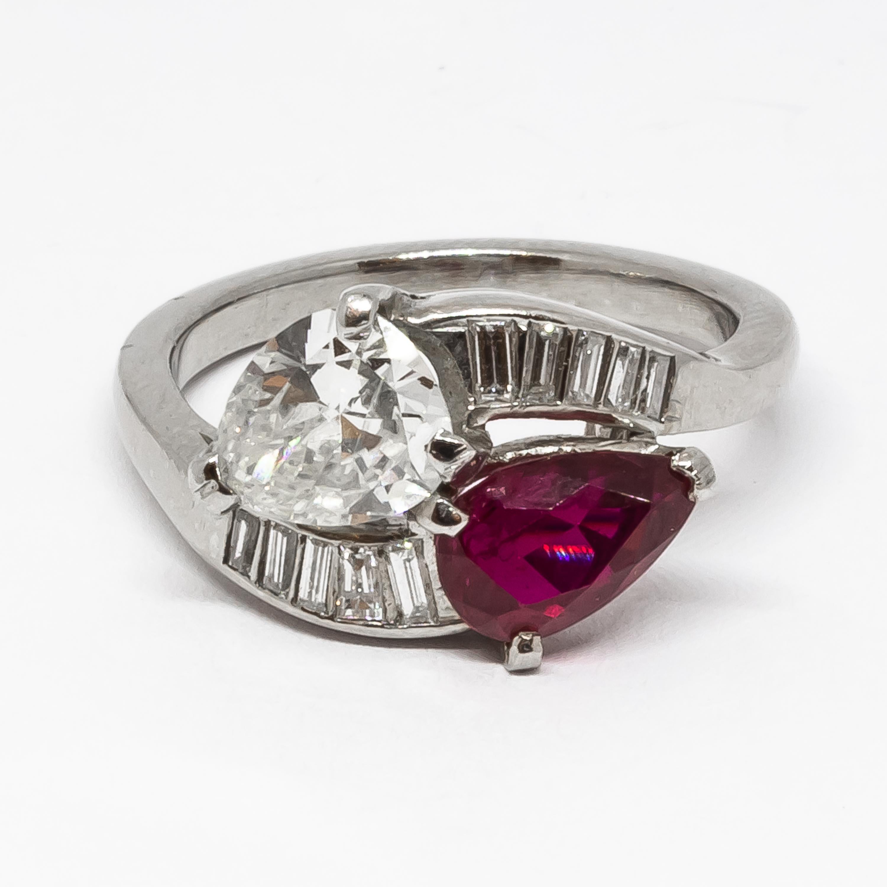 Pear Cut Vintage Ruby, Diamond And Platinum Crossover Ring, Circa 1950 For Sale