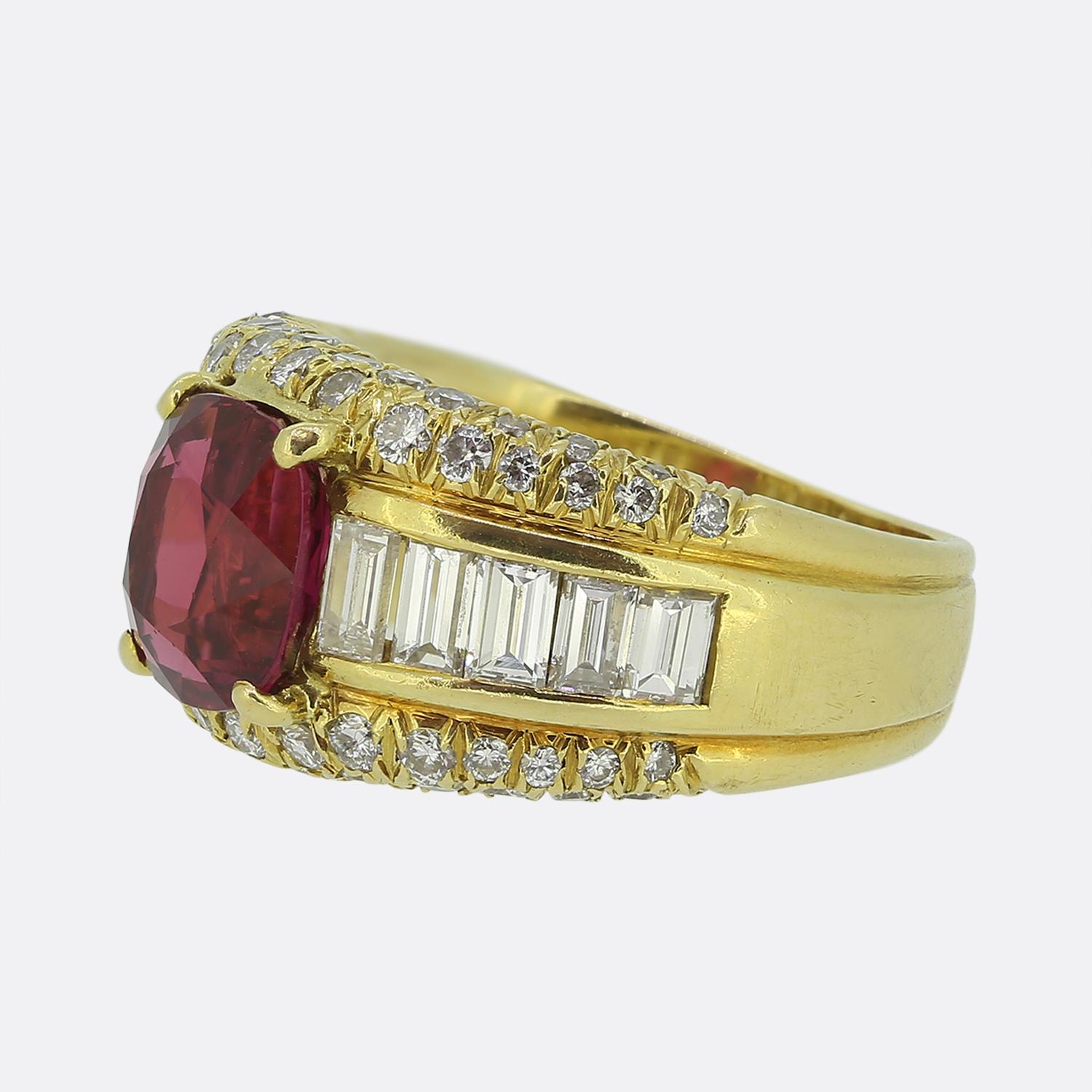 Here we have a spectacular vintage ruby and diamond bombe ring. The focal point of the ring is a cushion cut ruby with a spectacular rich red hue. The ruby has a perfect clarity and is highly complimented by the contrasting bright white of the