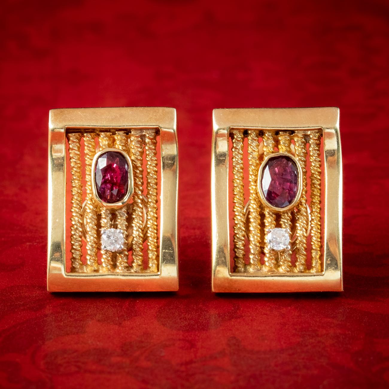 A remarkable pair of vintage earrings crowned with a twinkling brilliant cut diamond and a deep pink ruby bezel set above (approx. 0.60ct each). They’re modelled in solid 14ct gold and have a gentle curve to their design with rows of coiled wire