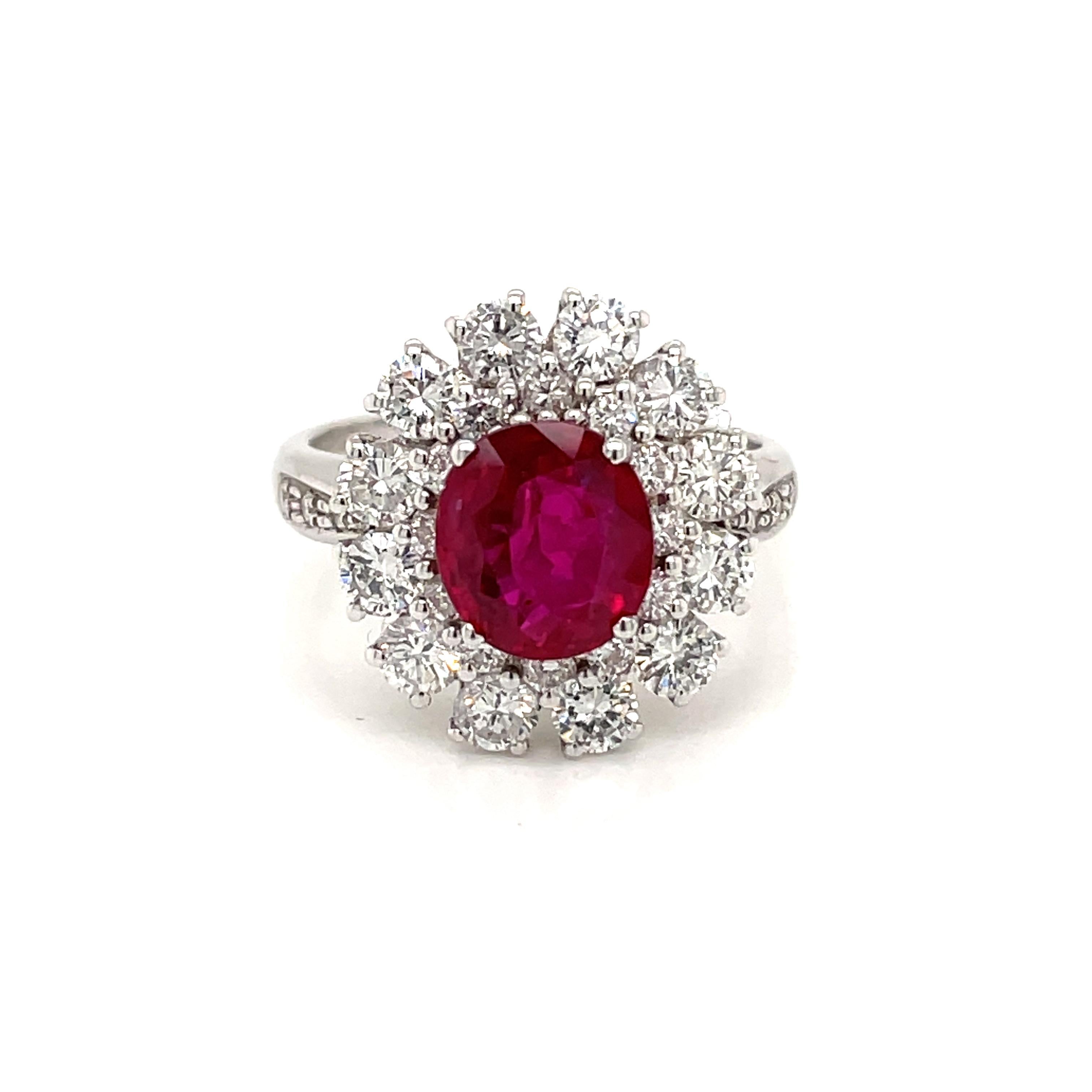 Exceptional 18k white Gold cluster ring features a 2.07 Carat oval-cut Ruby, surrounded by round brilliant cut Diamonds for a total approx. weight of 1.60 carats color H/I Vs clarity.

Ring Size: US 6 - IT 12 - FR 52 - UK M
This ring may be