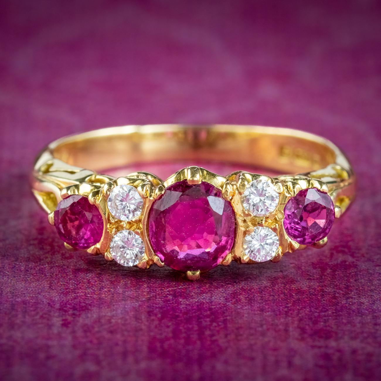 A gorgeous 1980s carved half hoop ring set with a trilogy of cherry-pink rubies which are accompanied by a detailed ruby report which indicates they’re of Thailand or East African origin and are all natural with some signs of heat treatment on the