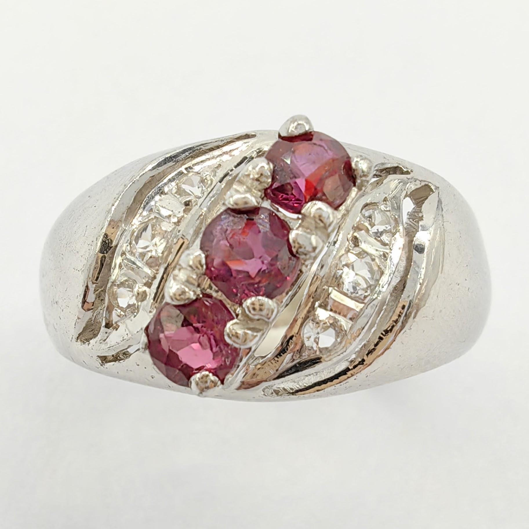 Introducing our exquisite Vintage Ruby Diamond Ring in 925 Sterling Silver, a timeless piece that effortlessly combines the captivating allure of rubies and diamonds with the elegance of sterling silver. This enchanting ring features a delicate