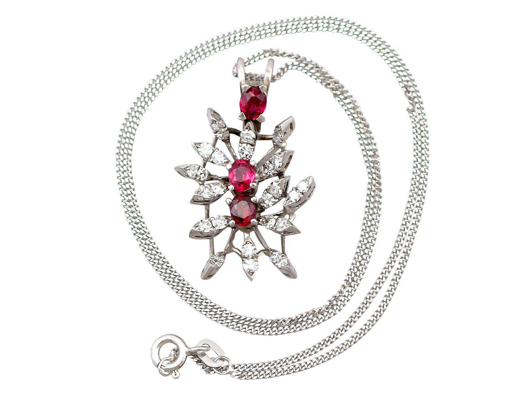 A fine and impressive vintage 0.88 carat ruby and 0.69 carat diamond, 18 karat white gold pendant; part of our diverse vintage jewelry collections.

This fine and impressive ruby and diamond pendant has been crafted in 18k white gold.

The pierced