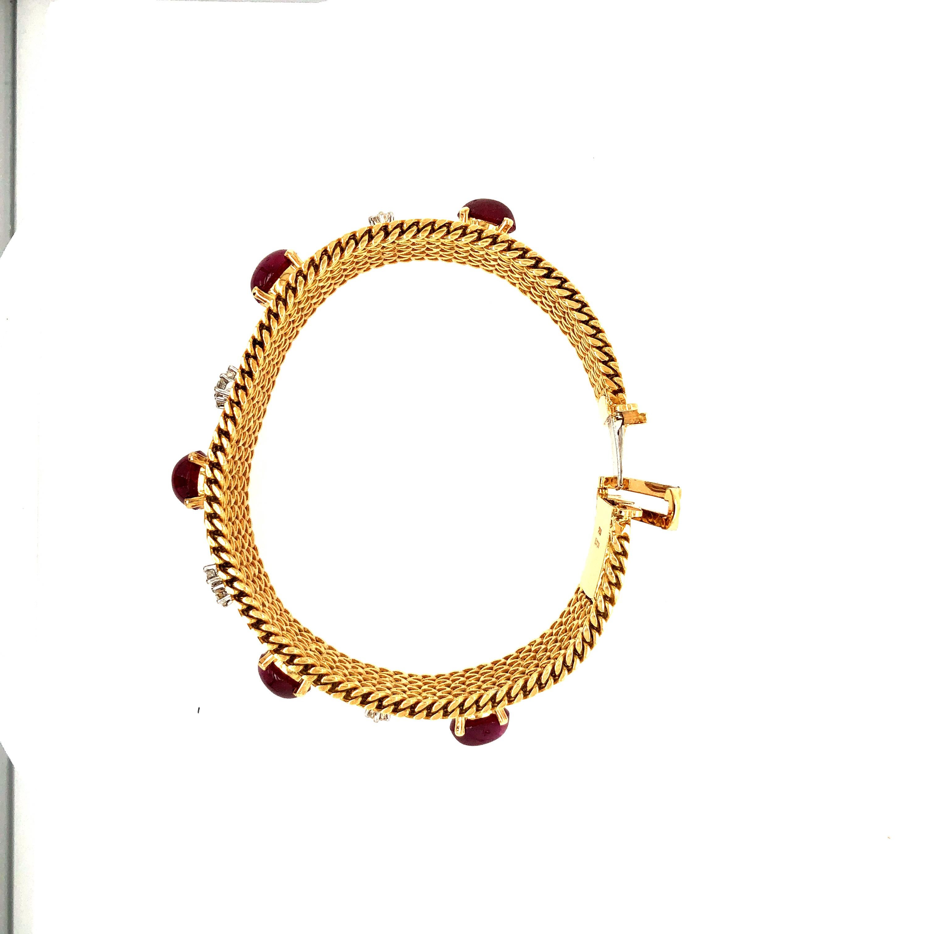 Offered here is a vintage 18 kt yellow gold mesh bracelet circa mid last century.
Flexible mesh bracelet, handmade in 18 kt yellow gold adorned with 5 natural cabochon rubies and 8 natural earth mined diamonds.
Ruby: 5 natural earth mined cabochon