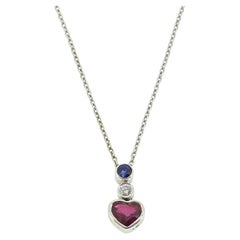 Collana vintage con cuore di rubino, zaffiro e diamante