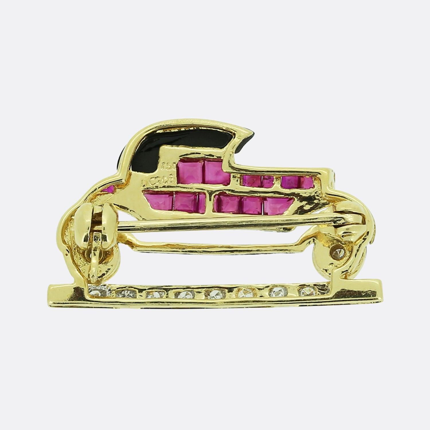 Here we have a superb vintage brooch. The piece has been crafted from 18ct yellow gold into the shape of a classic car from the 1930s. Automobiles of the 1930s exhibited many notable features; whilst being longer and lower in body design, these