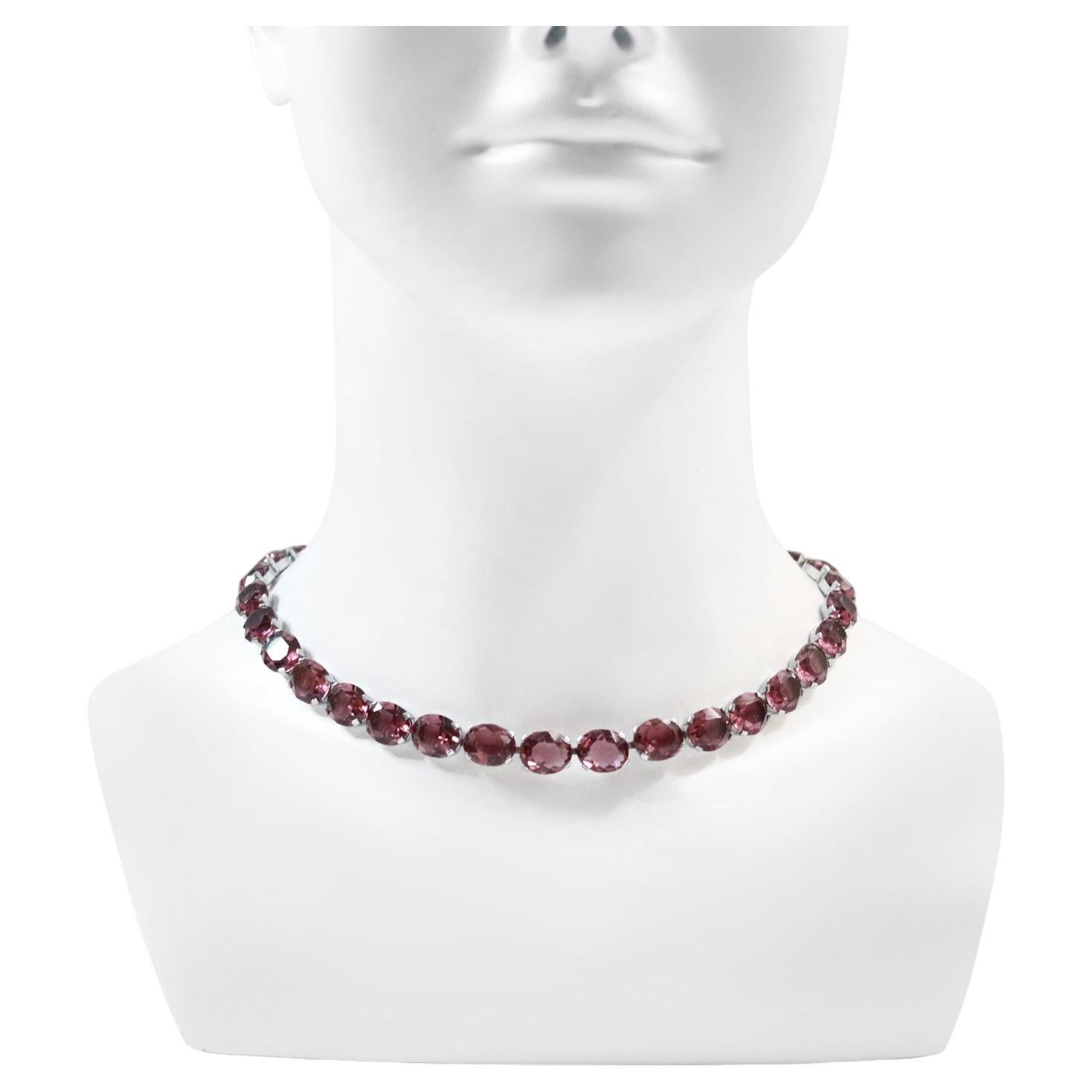 Vintage Purple Open Back Crystal Necklace Circa 1960s. Most people don't understand the beauty of these until they try them on.  This beautiful color has the ability to look pink, red, purple, lavender or a multitude or hues dependent on what it is