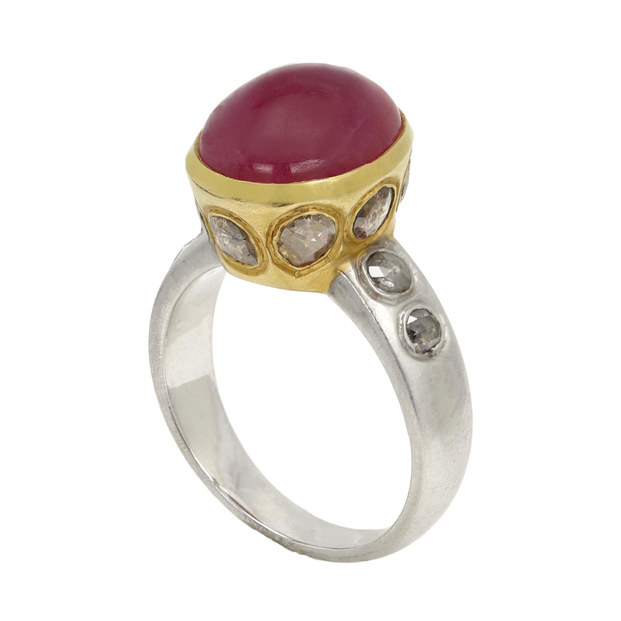 Vintage Ruby & Diamonds - Hand Made in Italy
18k Two Tone Yellow & White Gold 8.40 grams - mat finish (not shiny gold)
Ruby Cabochon 5.60 Carat Oval shape / Dome  approx size 12 x 10 mm
Nice Royal Dark Red Tone in Bezel set.
the Ruby Stone is not